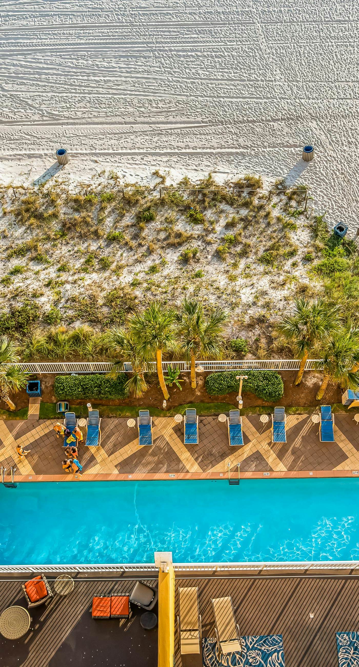 Snow-bird friendly condo with pool & fitness room - walk right out to the sand