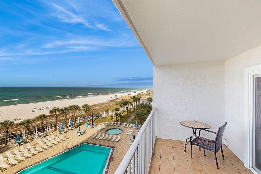 Cozy beachfront condo with private balcony, shared pool & beach access