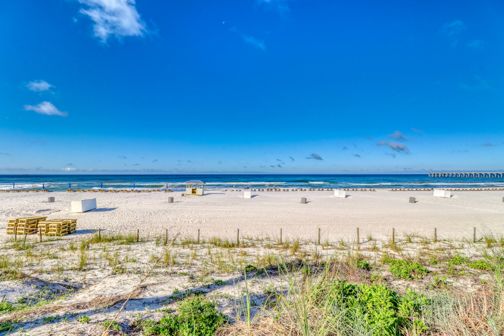 Charming, beachfront condo with furnished balcony & a bi-level pool