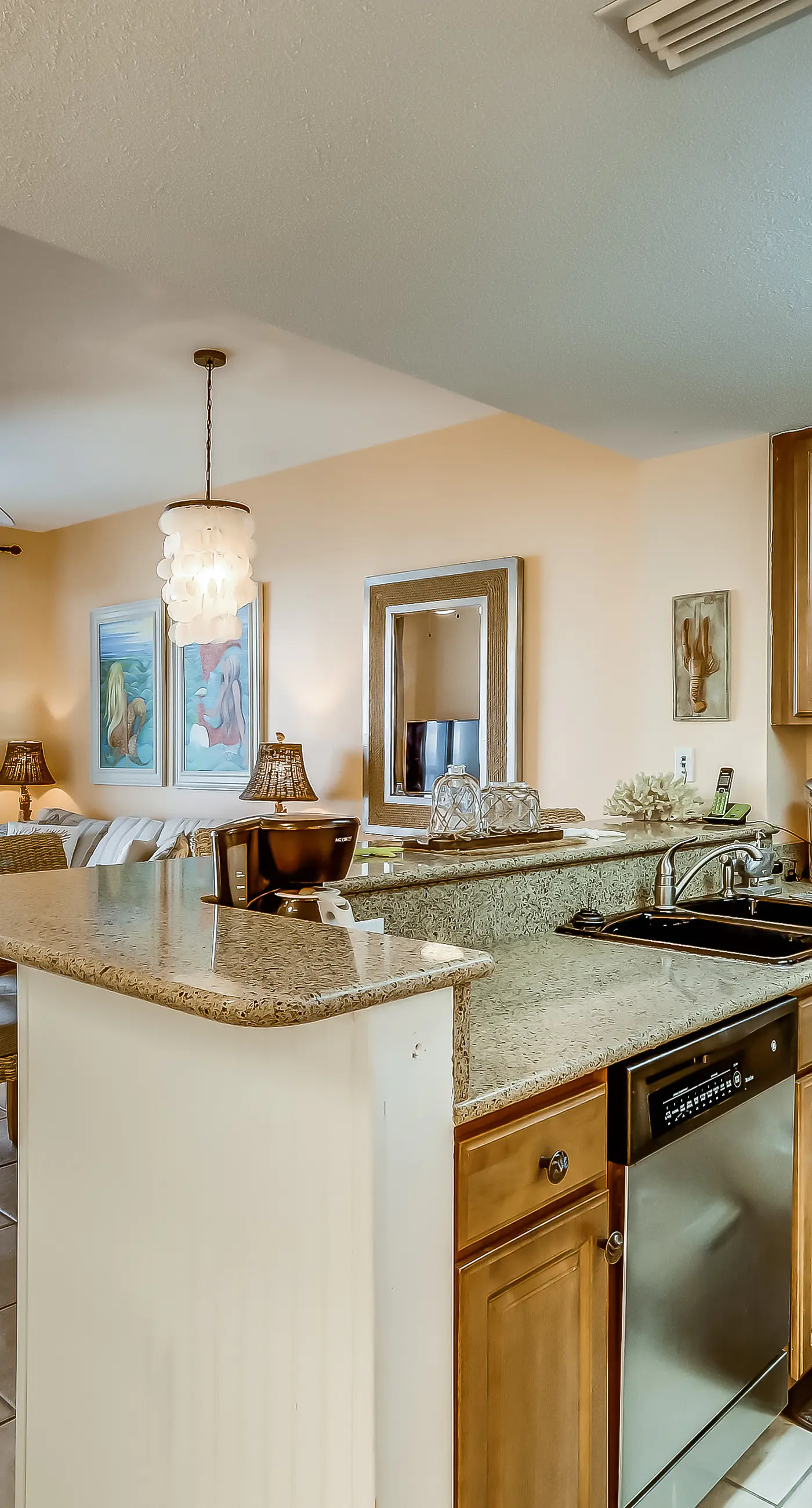 Serene & upscale beachfront condo with furnished balcony, view, & pools