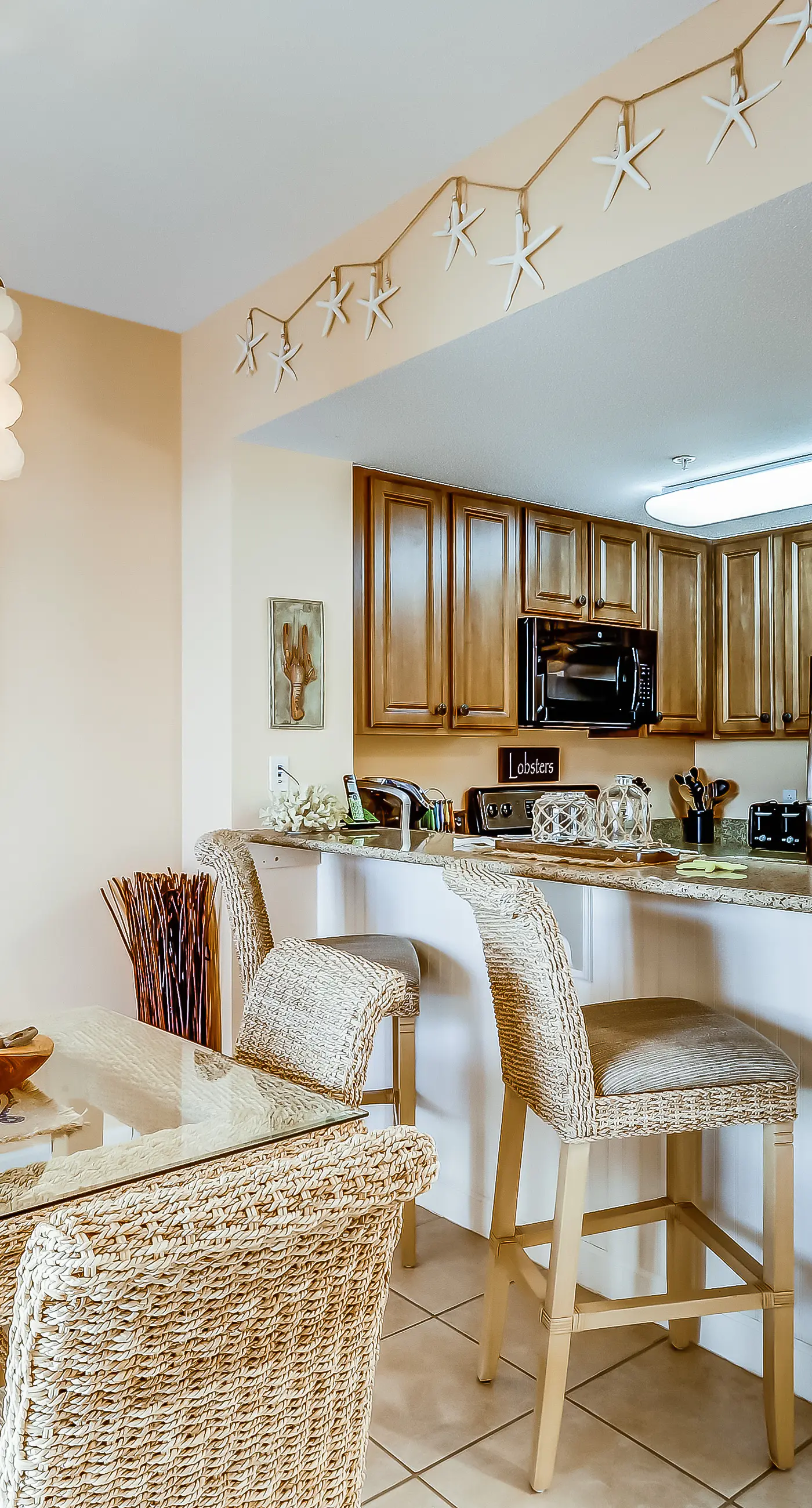 Serene & upscale beachfront condo with furnished balcony, view, & pools