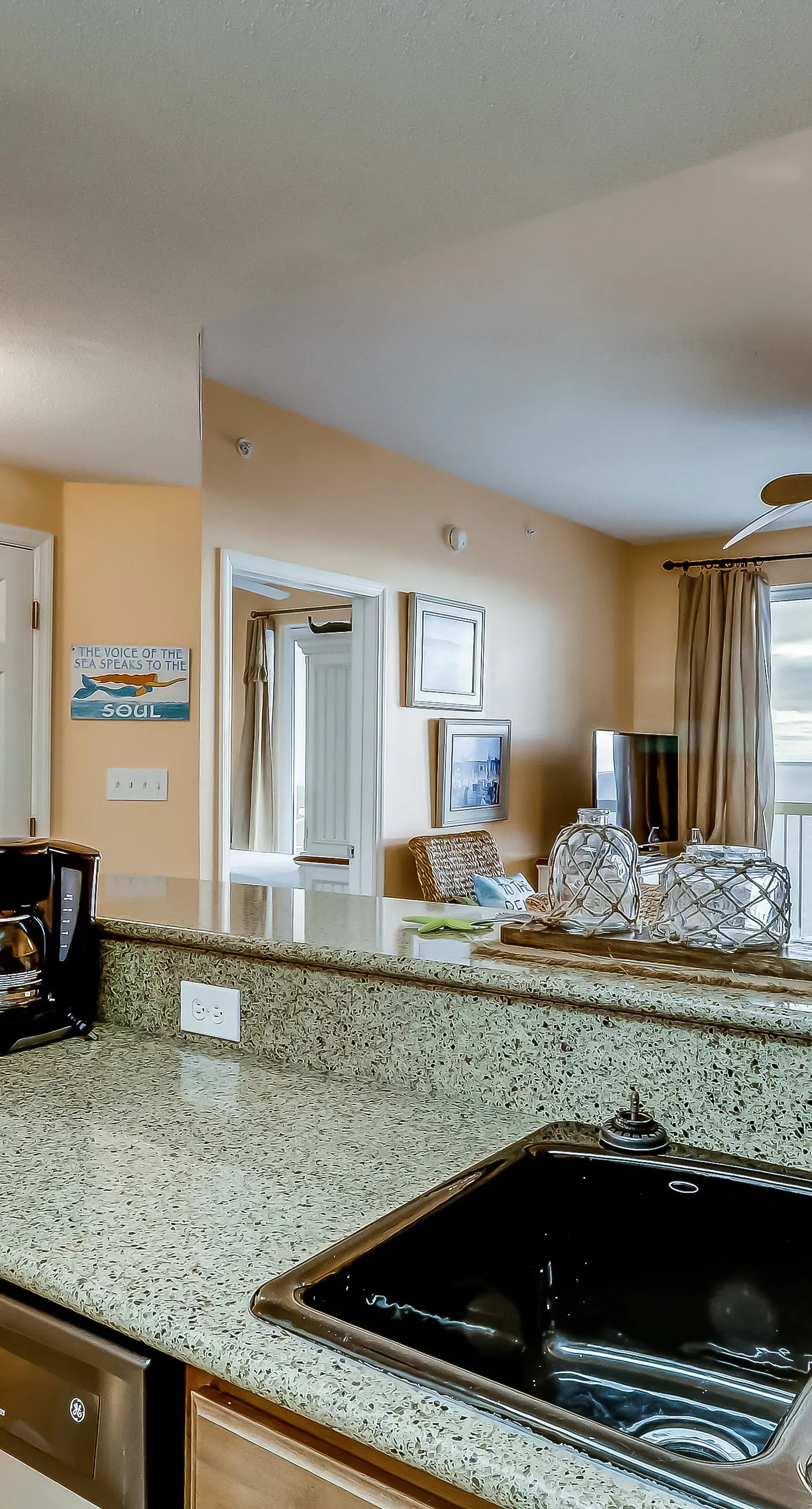 Serene & upscale beachfront condo with furnished balcony, view, & pools