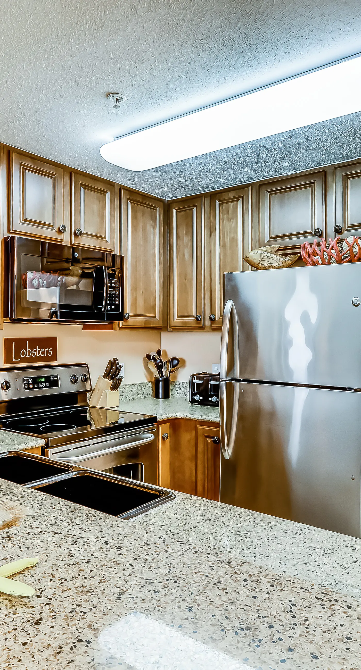 Serene & upscale beachfront condo with furnished balcony, view, & pools