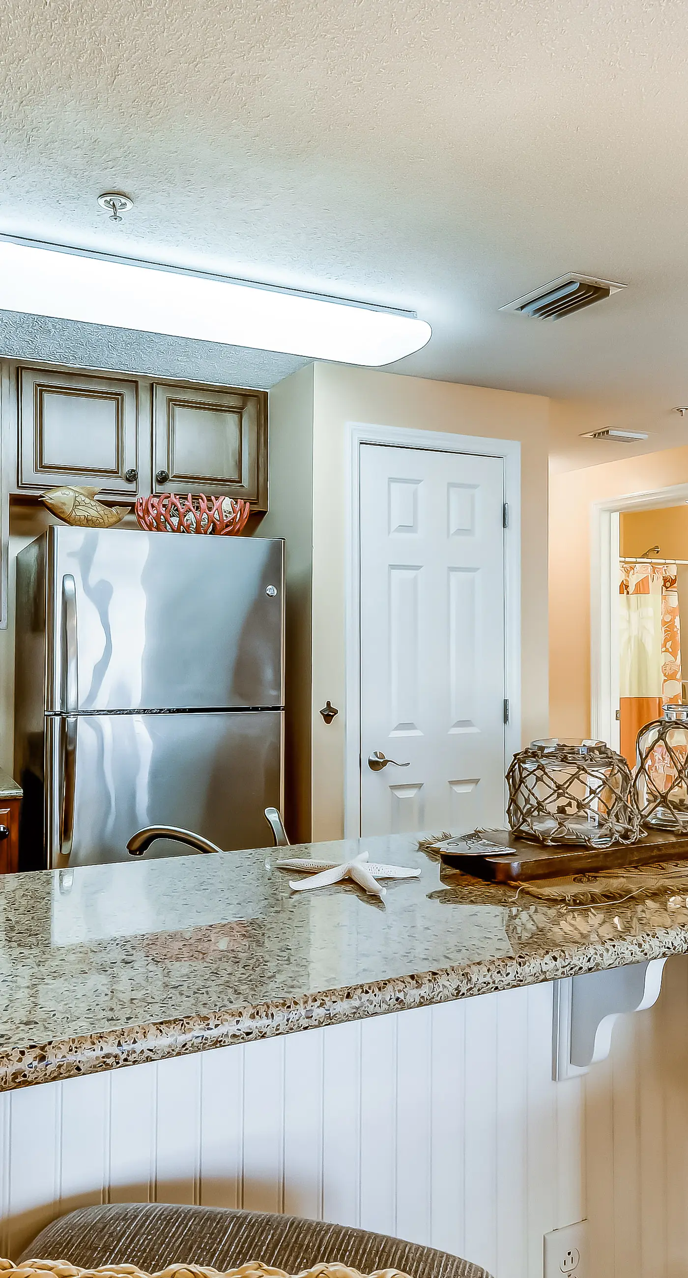 Serene & upscale beachfront condo with furnished balcony, view, & pools