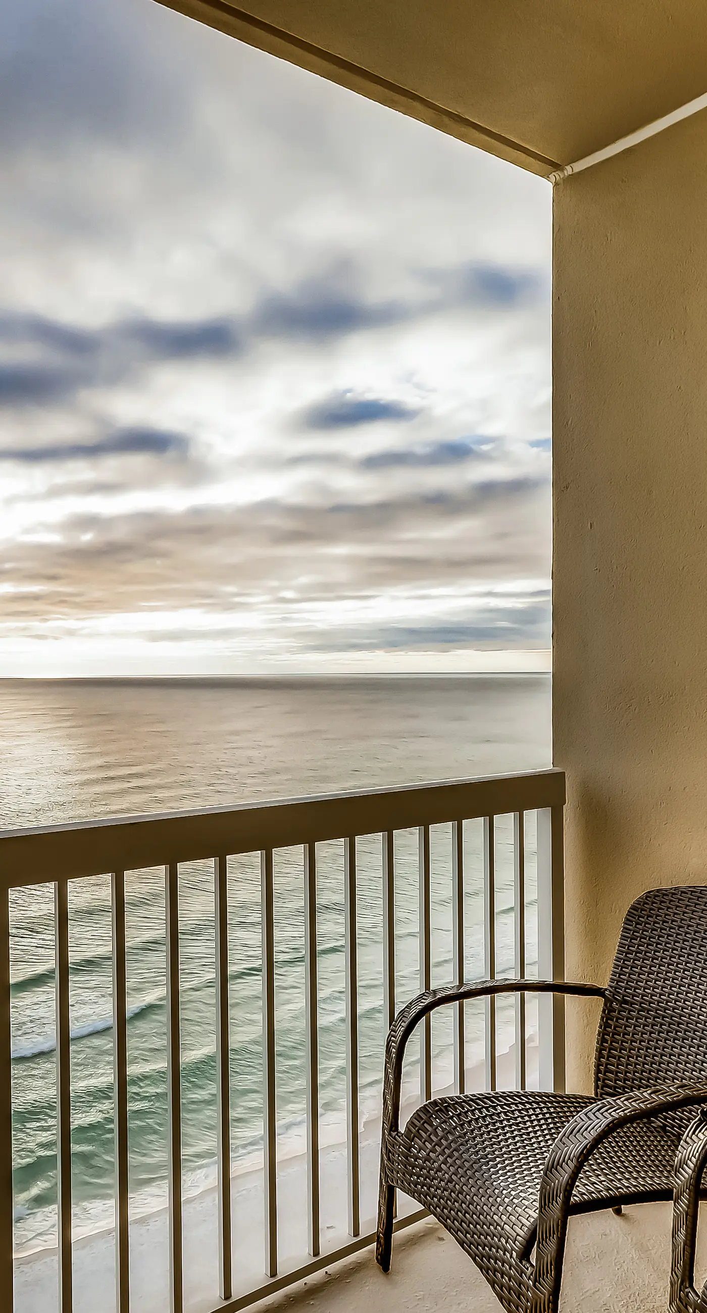 Serene & upscale beachfront condo with furnished balcony, view, & pools