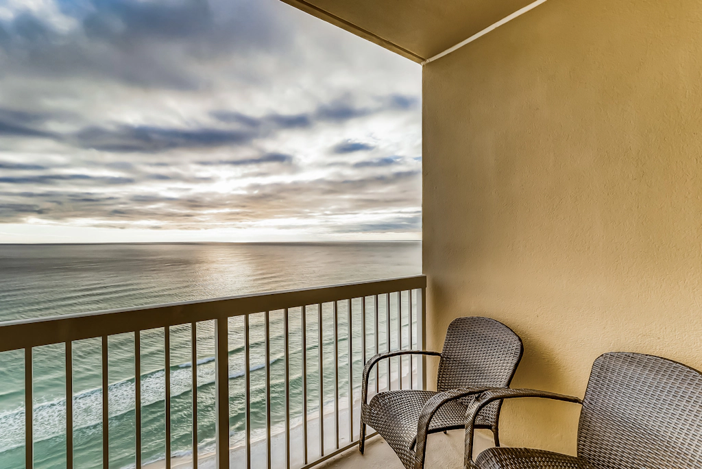 Serene & upscale beachfront condo with furnished balcony, view, & pools