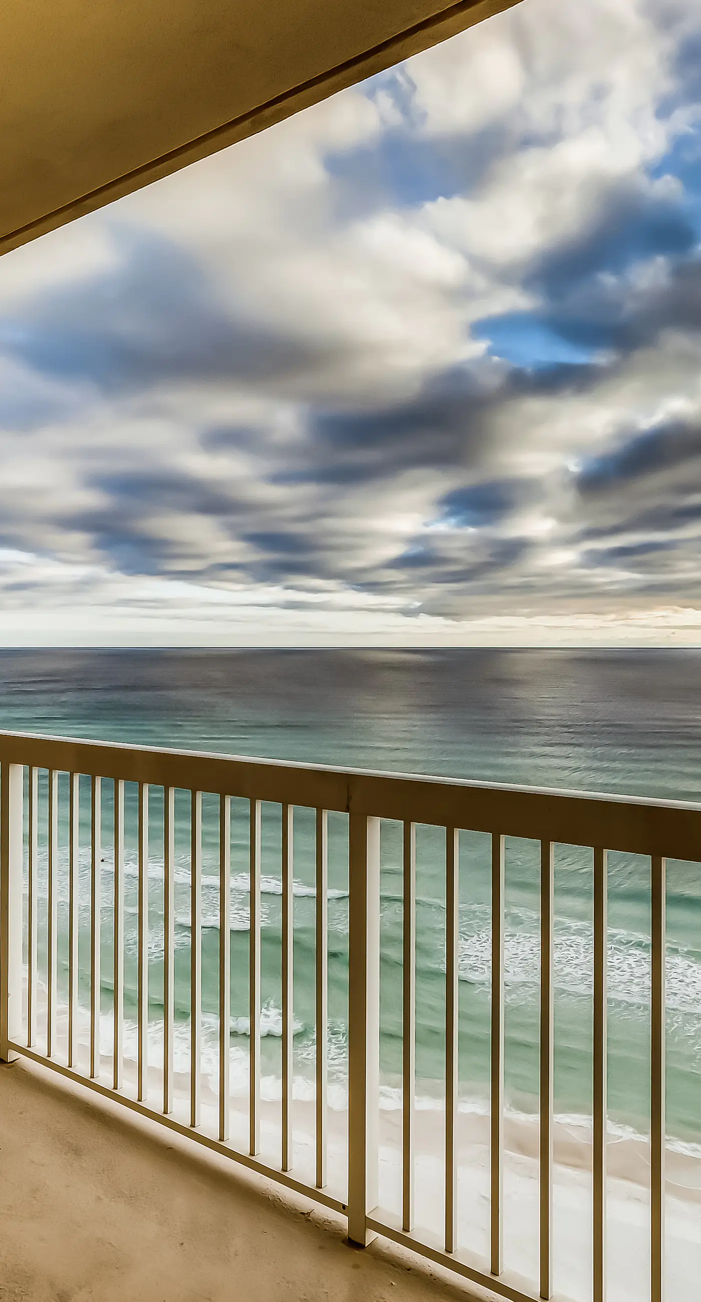 Serene & upscale beachfront condo with furnished balcony, view, & pools