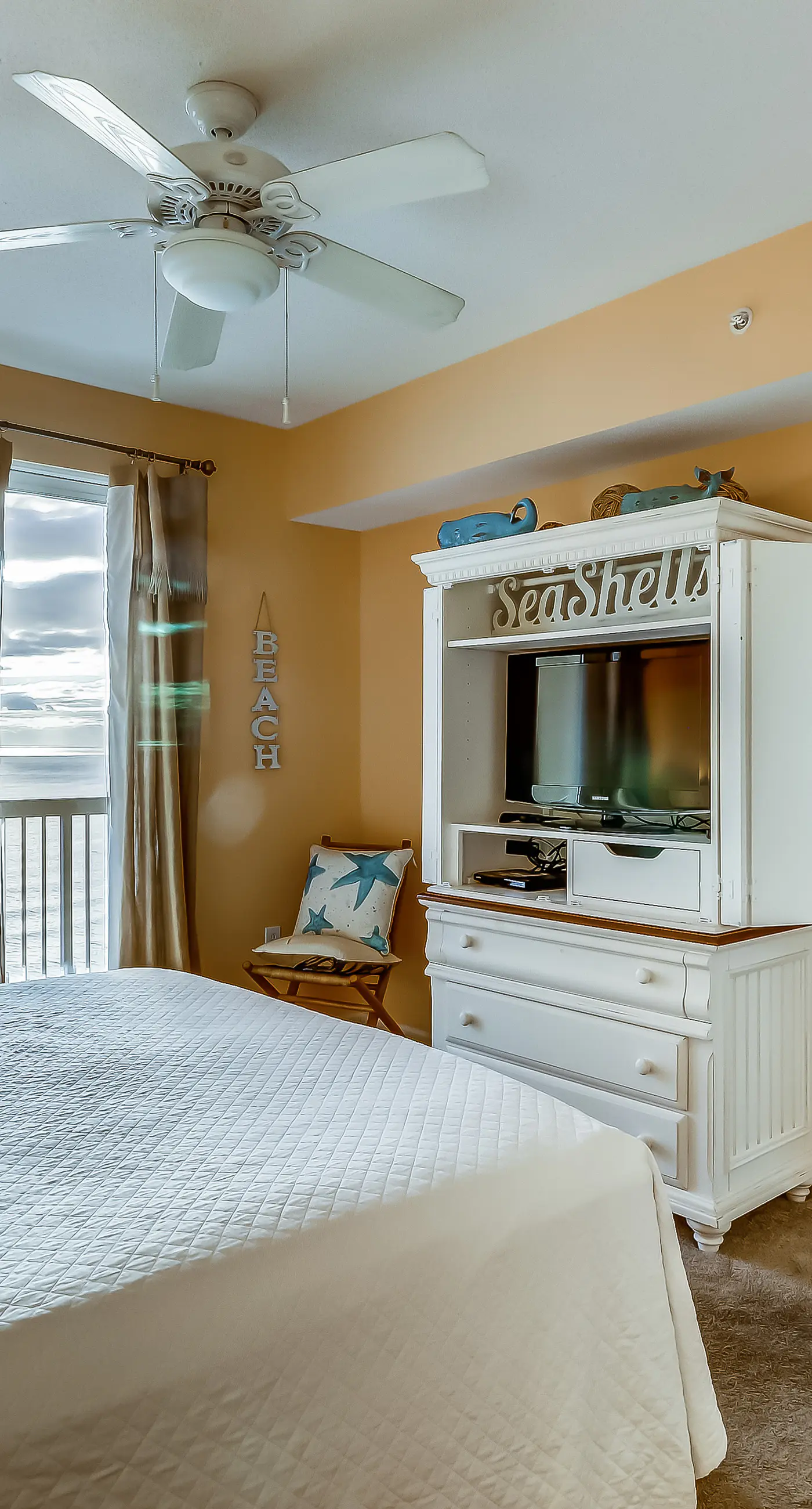 Serene & upscale beachfront condo with furnished balcony, view, & pools
