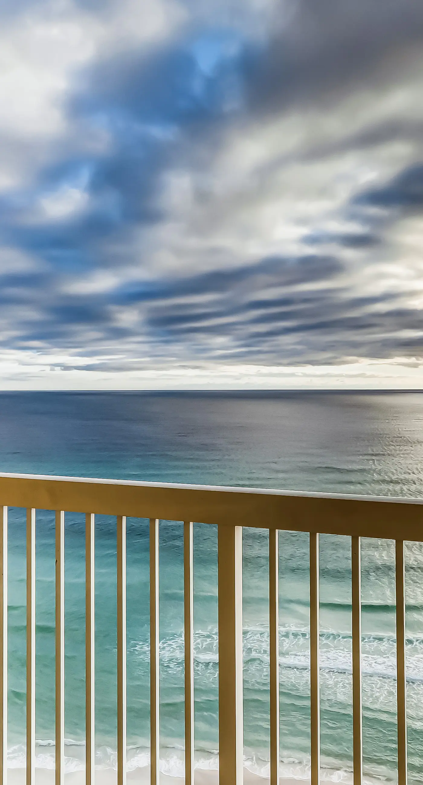 Serene & upscale beachfront condo with furnished balcony, view, & pools