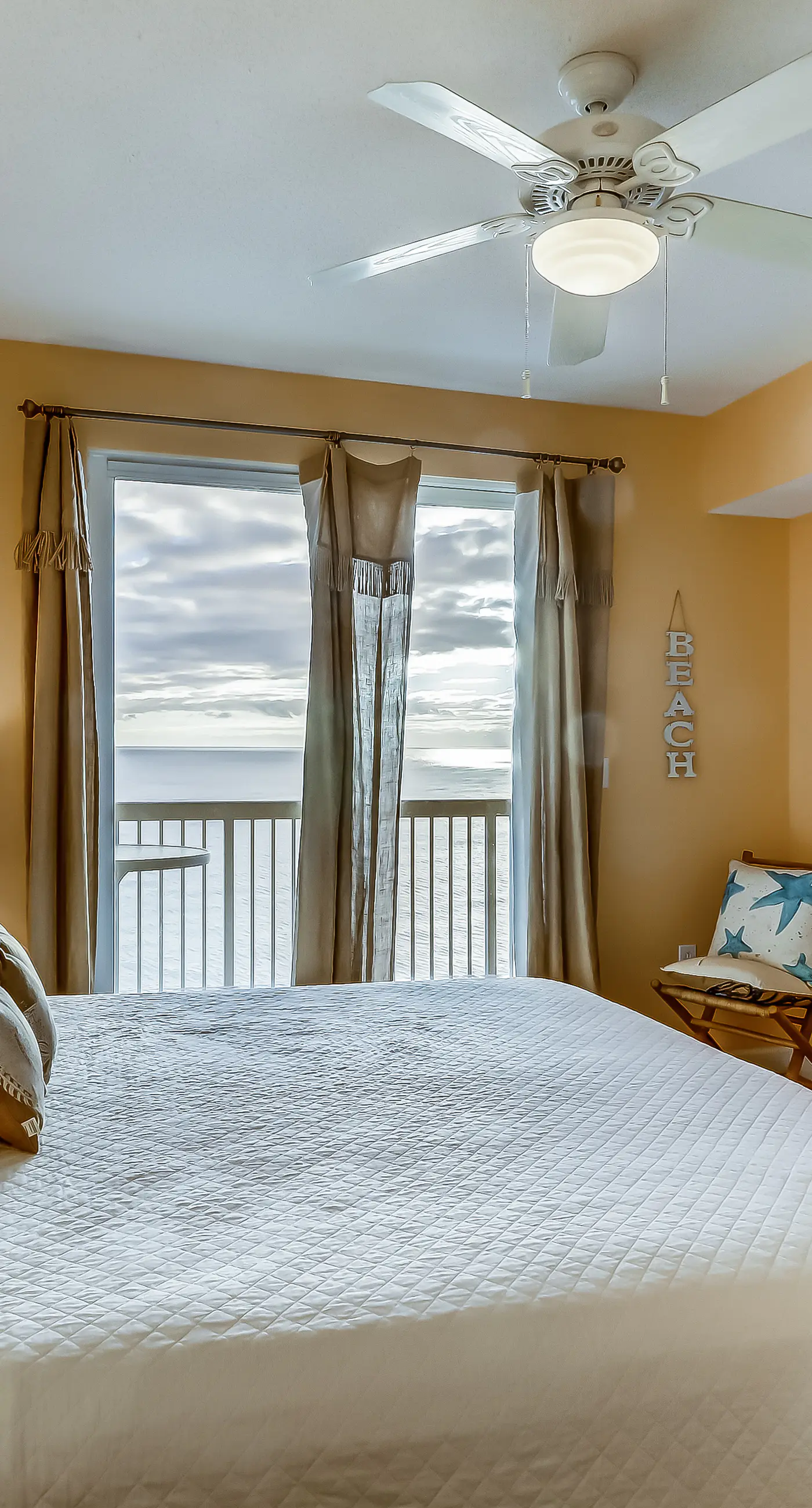 Serene & upscale beachfront condo with furnished balcony, view, & pools