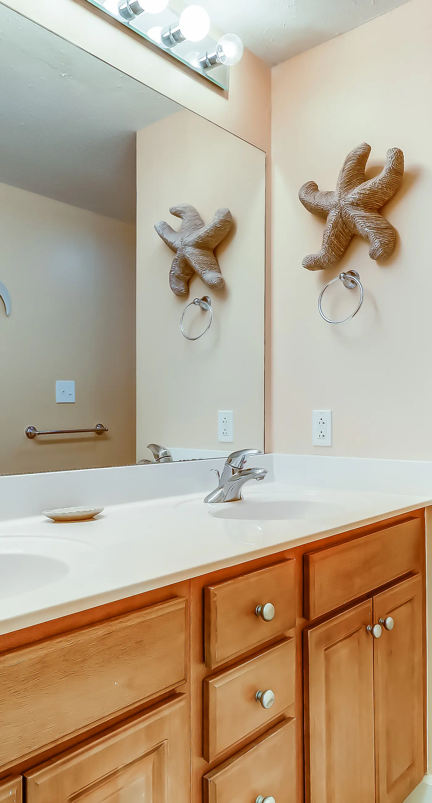 Serene & upscale beachfront condo with furnished balcony, view, & pools