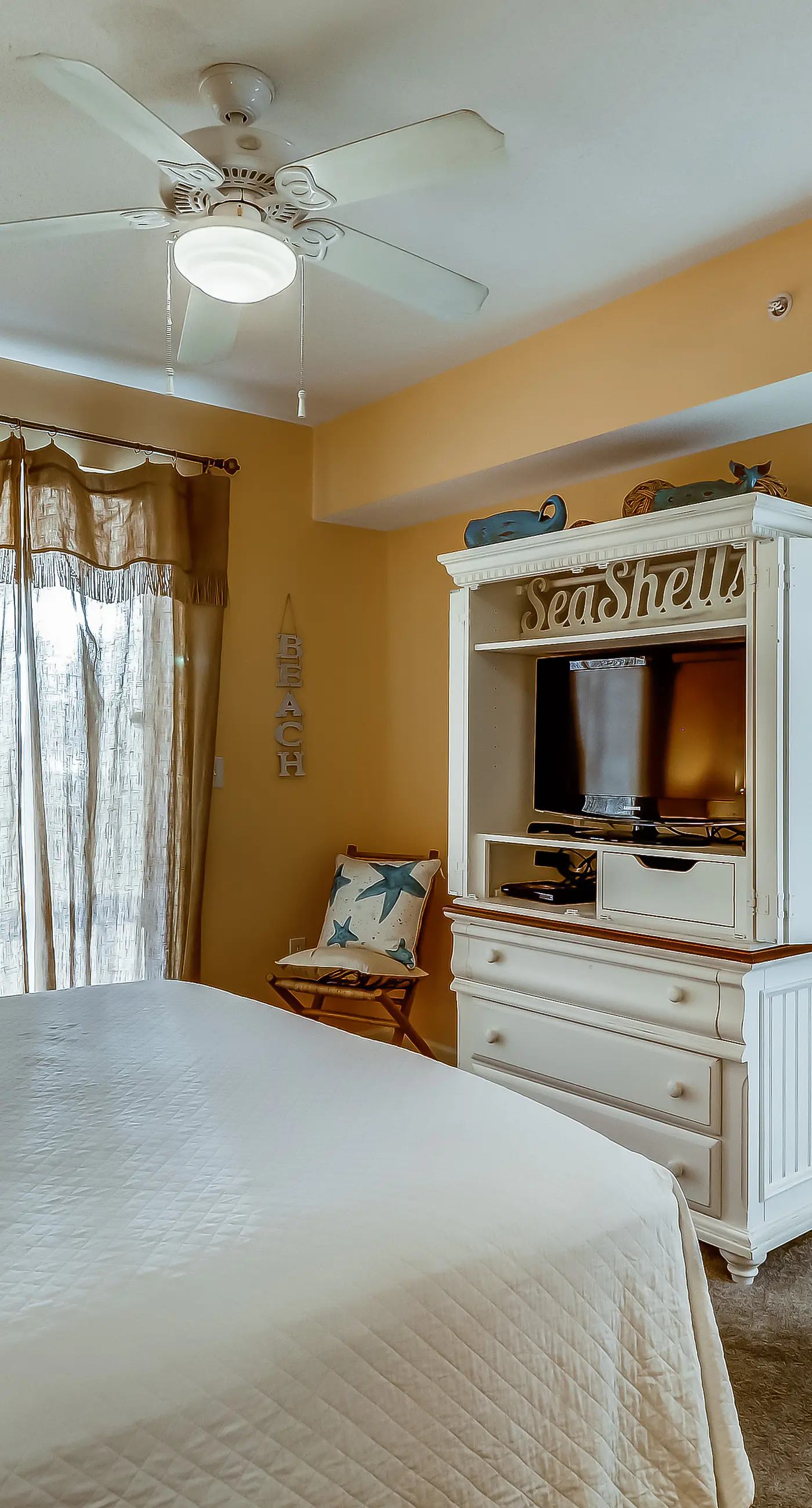 Serene & upscale beachfront condo with furnished balcony, view, & pools