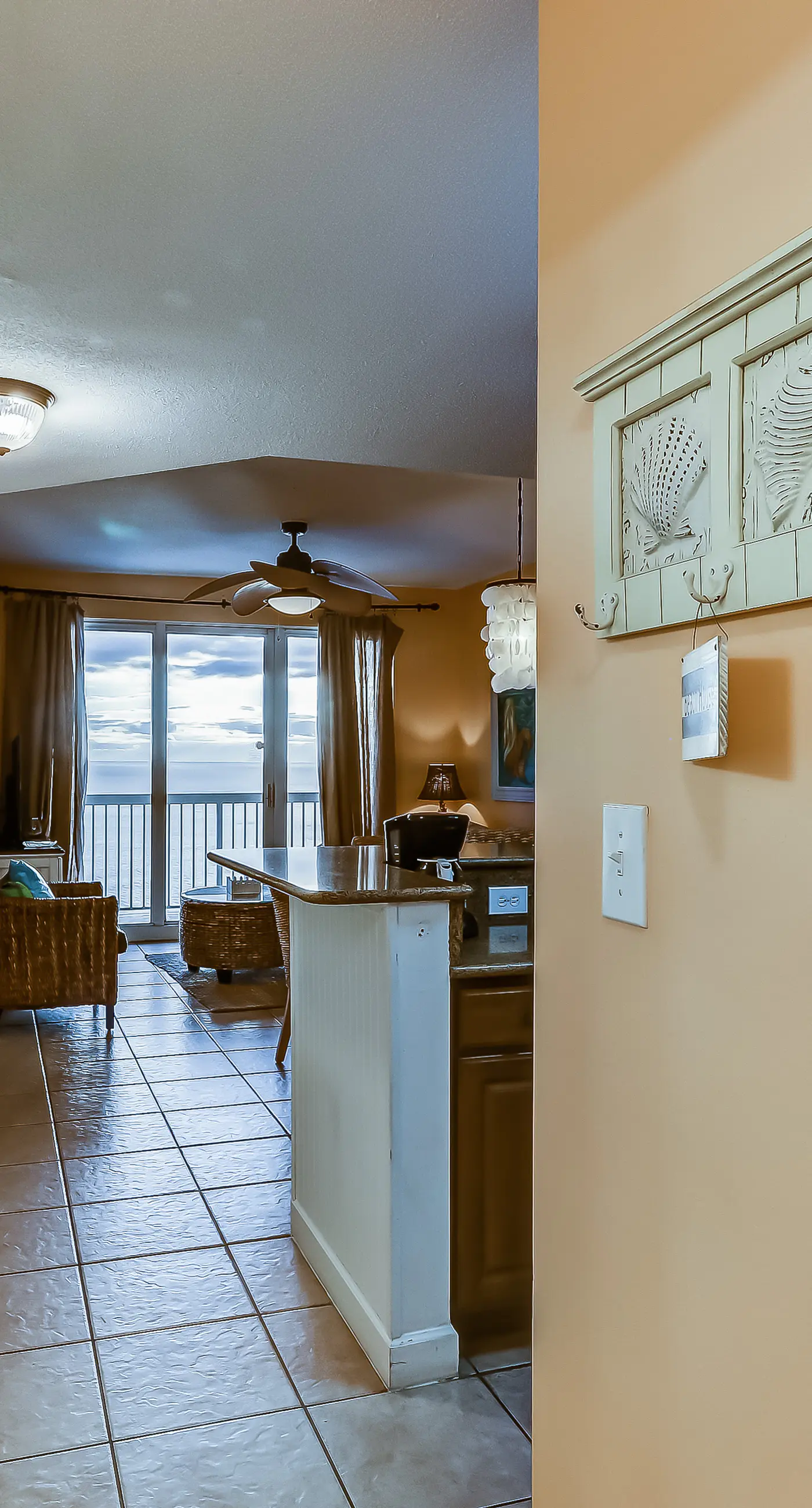 Serene & upscale beachfront condo with furnished balcony, view, & pools