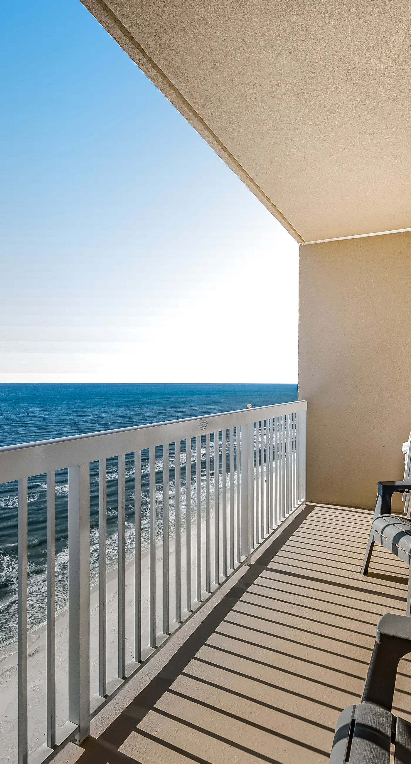 Tropical, waterfront oasis with furnished balcony, pools, & beach access