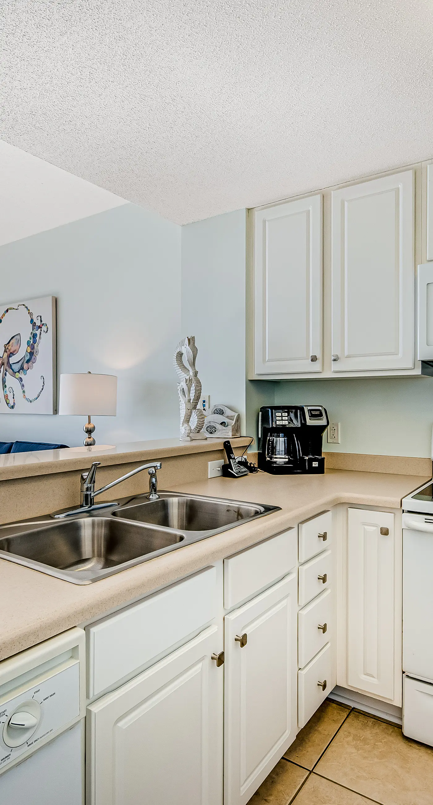 Tropical, waterfront oasis with furnished balcony, pools, & beach access