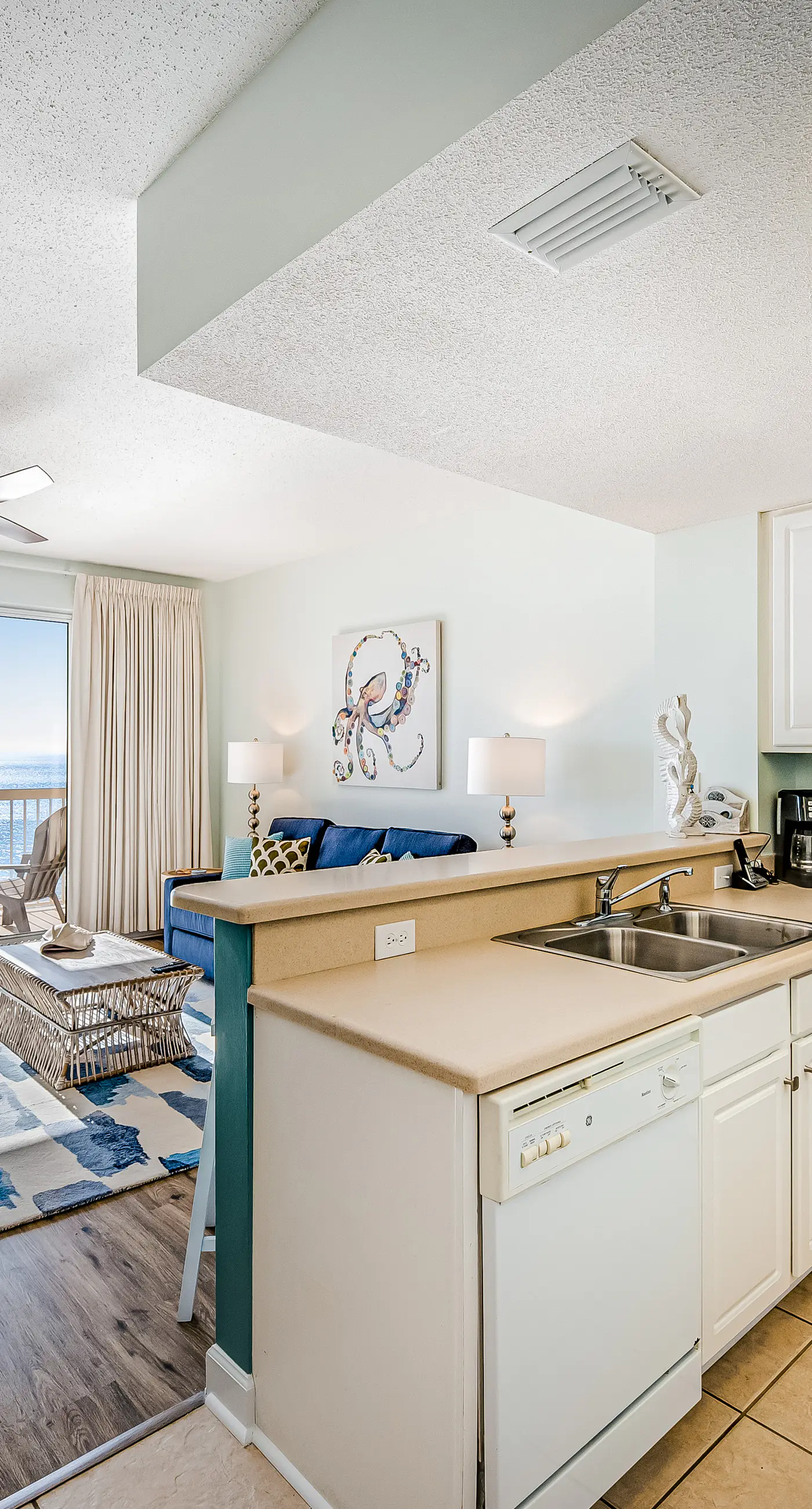 Tropical, waterfront oasis with furnished balcony, pools, & beach access