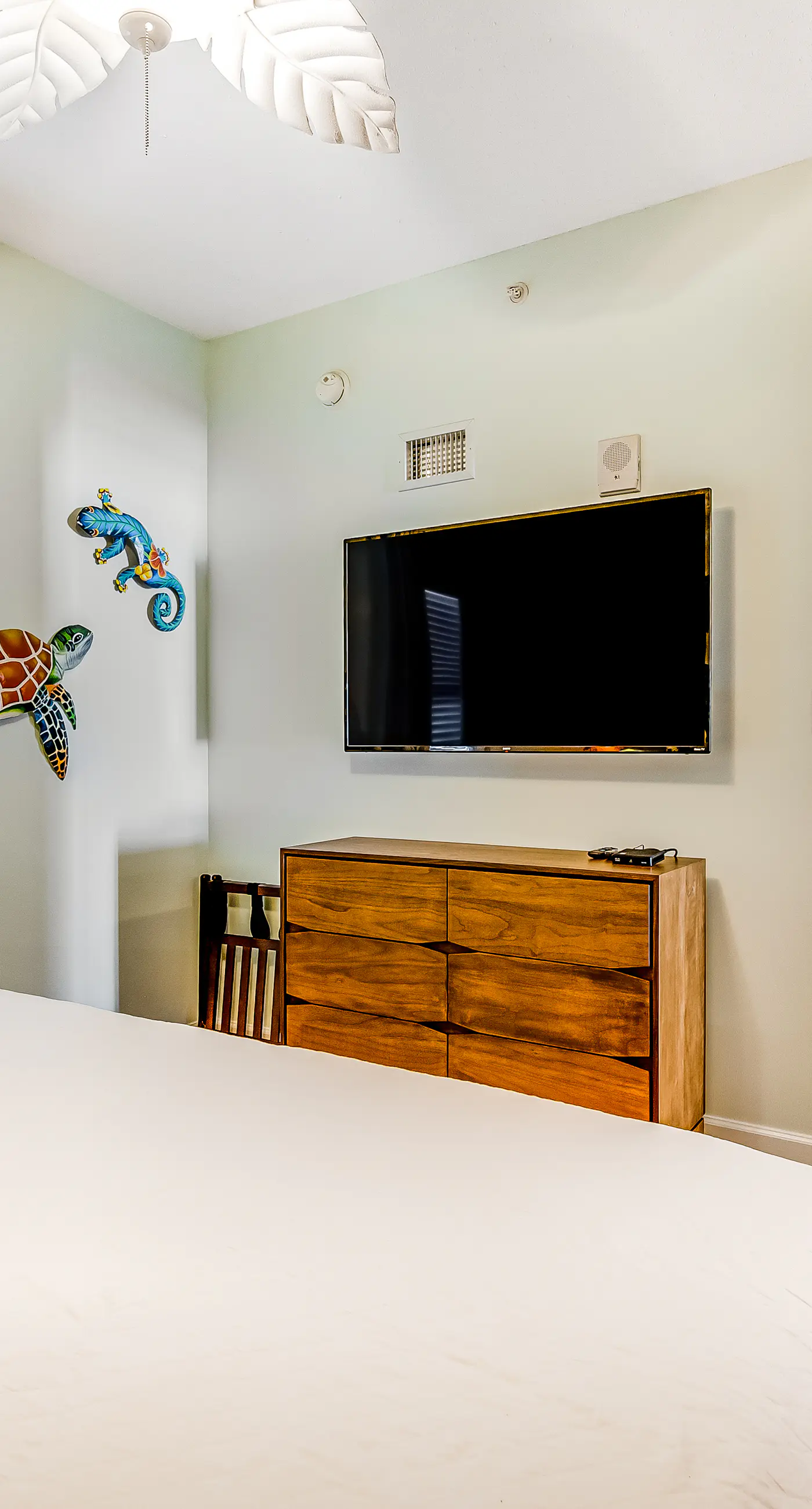Tropical, waterfront oasis with furnished balcony, pools, & beach access