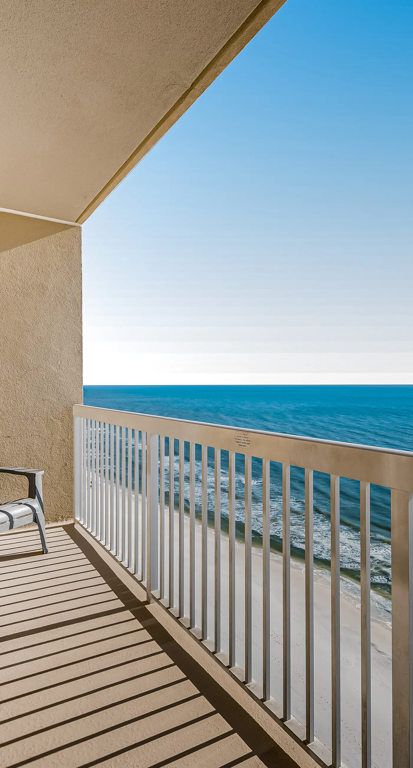 Tropical, waterfront oasis with furnished balcony, pools, & beach access