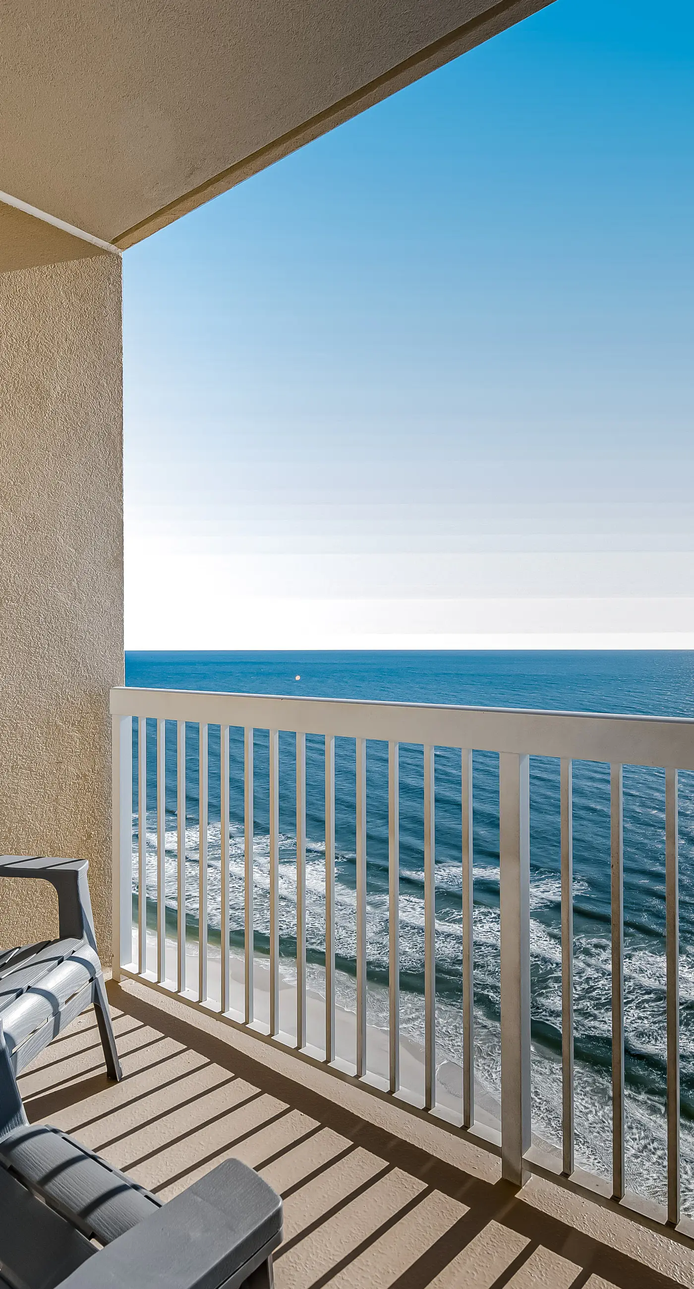 Tropical, waterfront oasis with furnished balcony, pools, & beach access