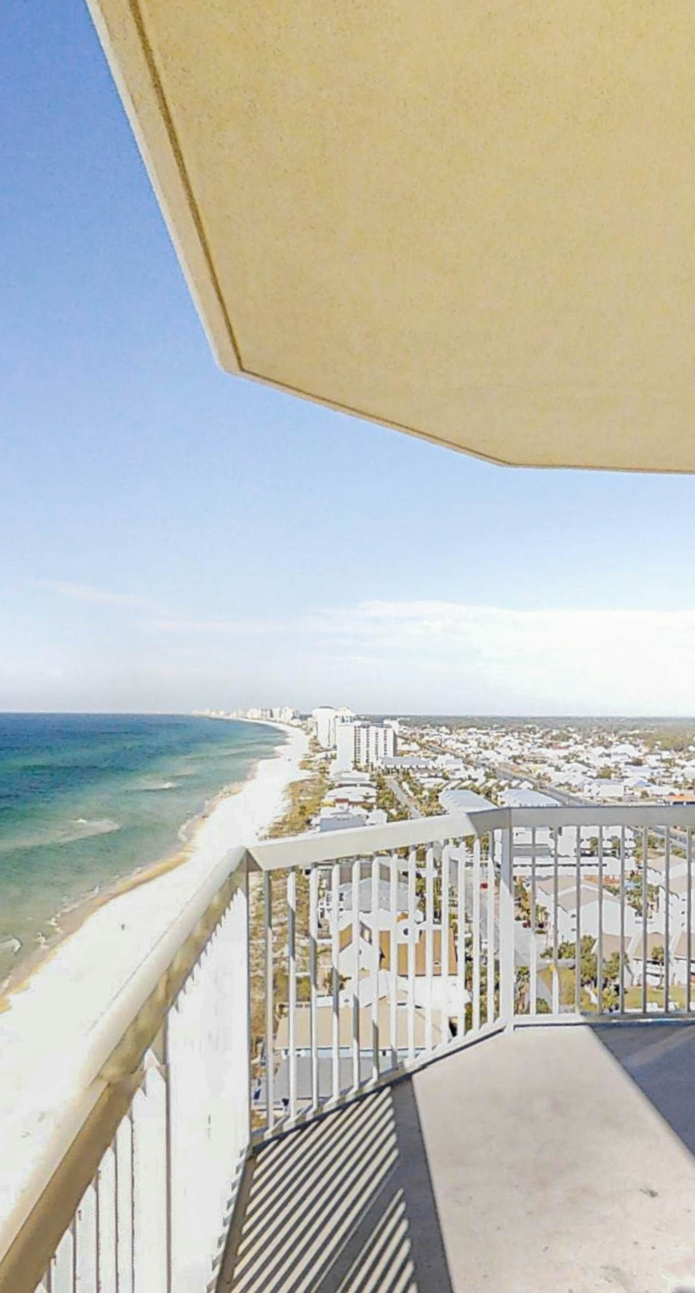 Chic & stylish beachfront condo with wraparound balcony, pools, & gym