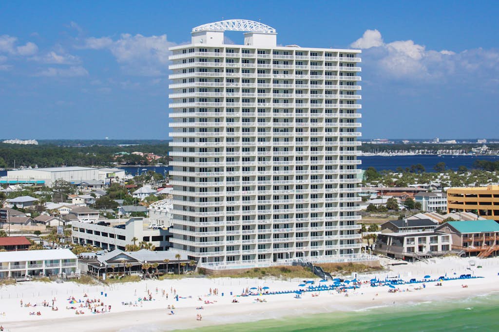 Chic & stylish beachfront condo with wraparound balcony, pools, & gym