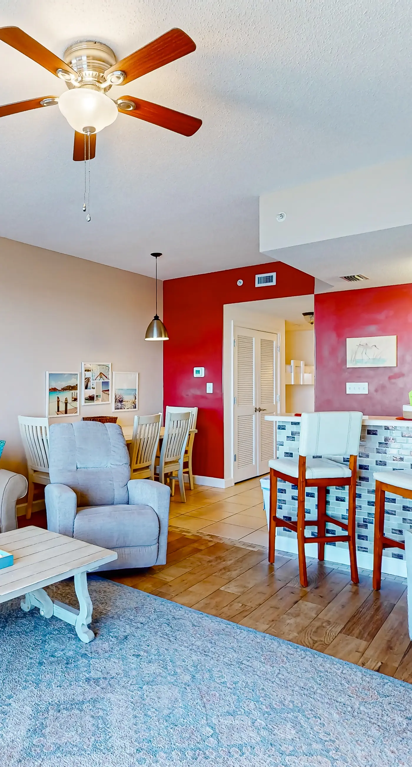 Cozy & colorful beachfront condo with balcony, pools, & fitness center