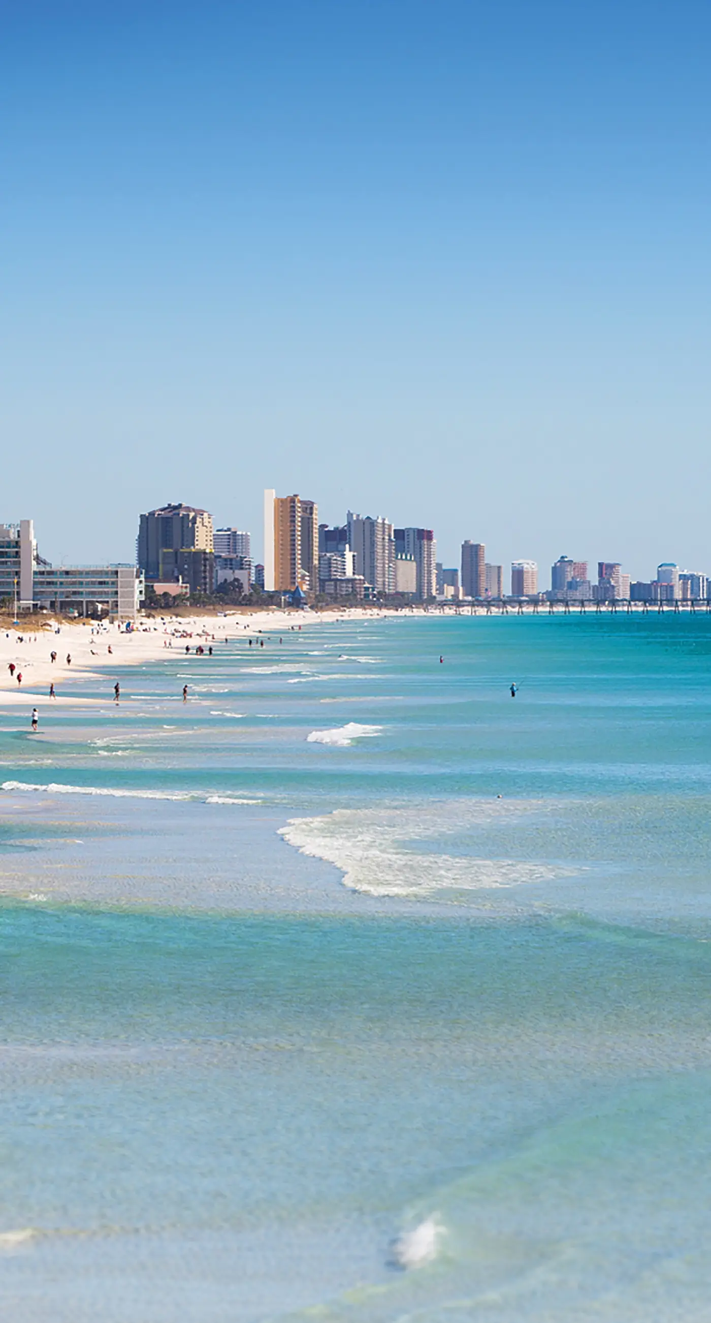 Cozy & colorful beachfront condo with balcony, pools, & fitness center