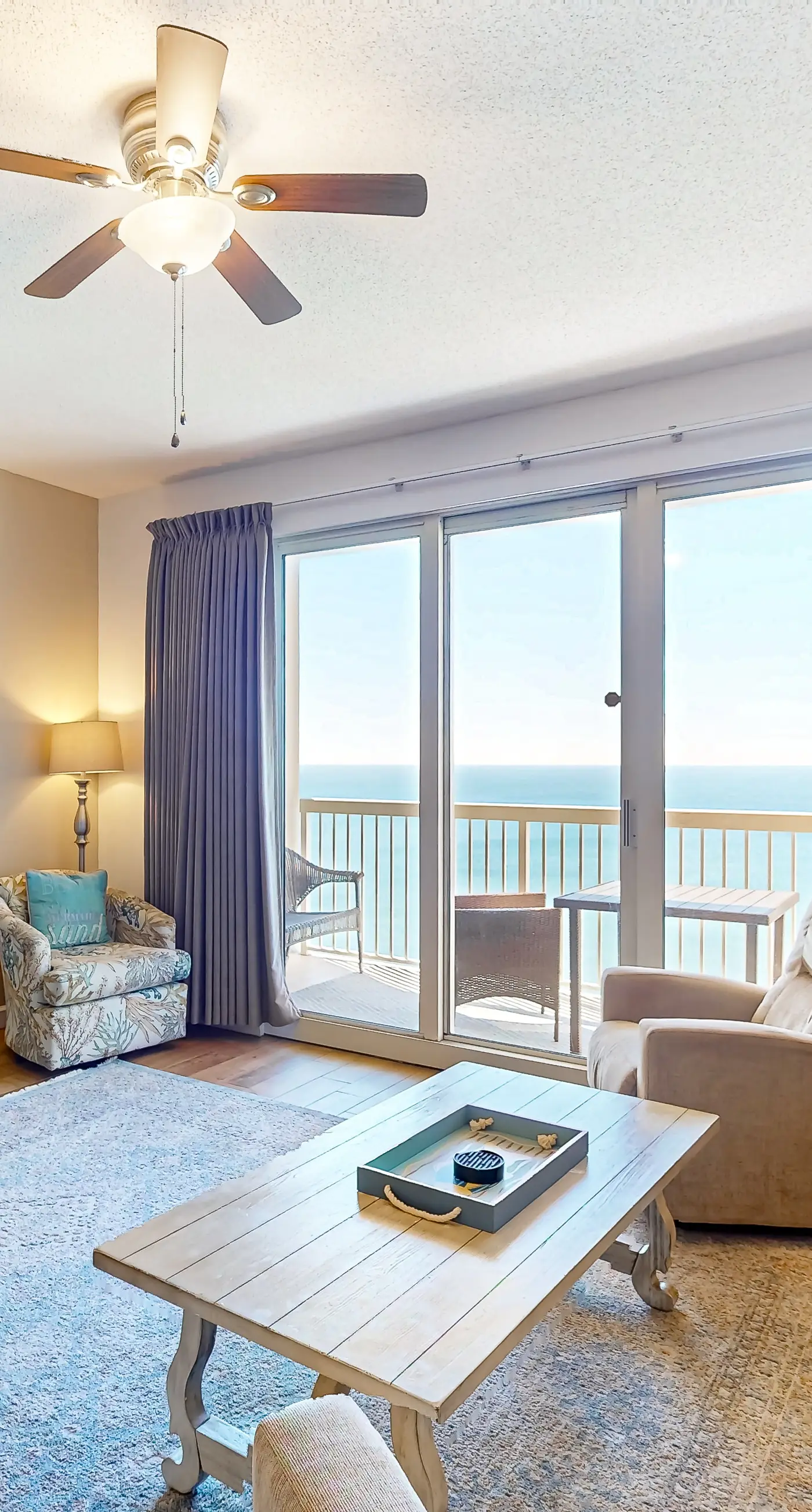 Cozy & colorful beachfront condo with balcony, pools, & fitness center
