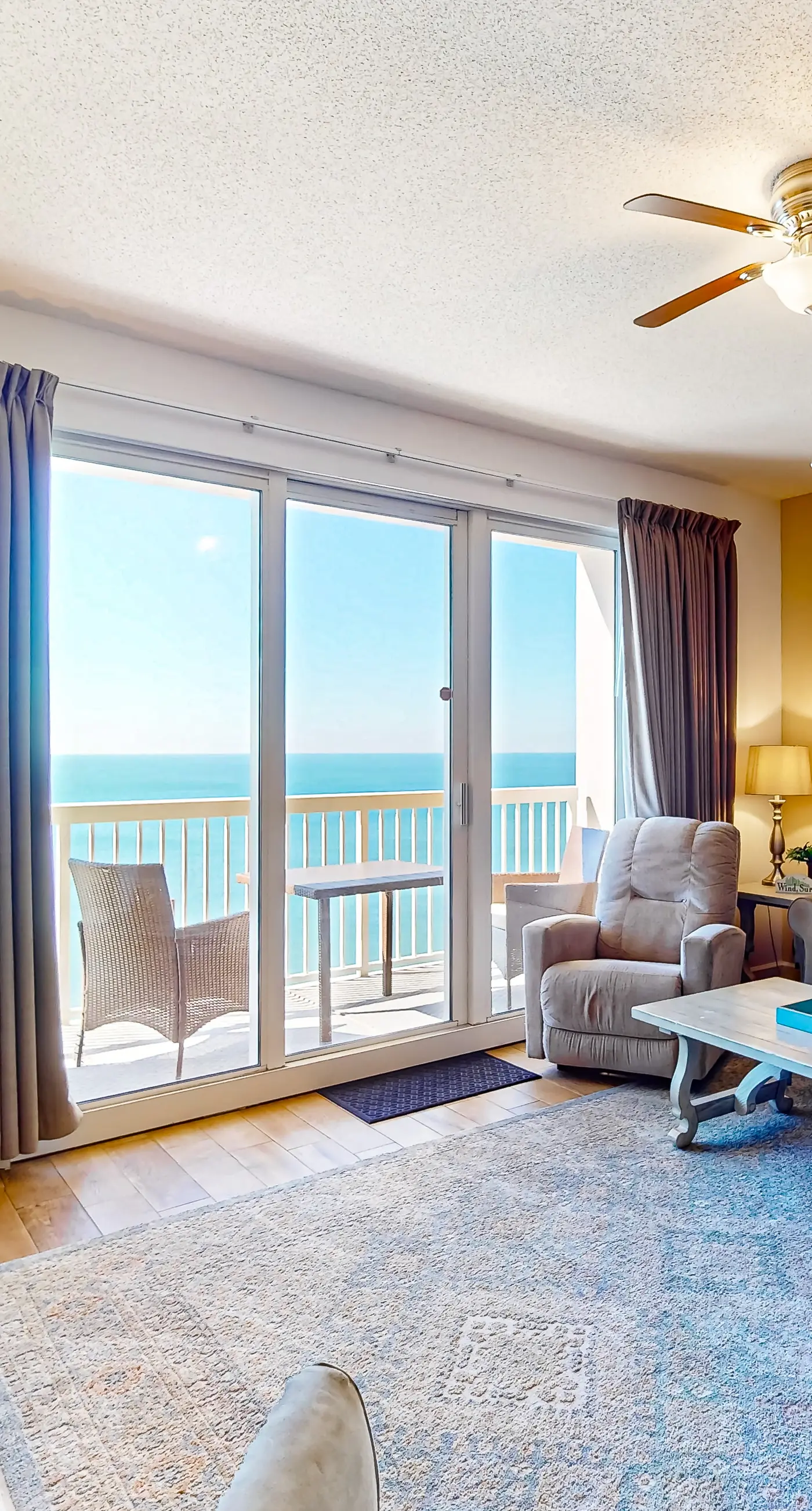 Cozy & colorful beachfront condo with balcony, pools, & fitness center