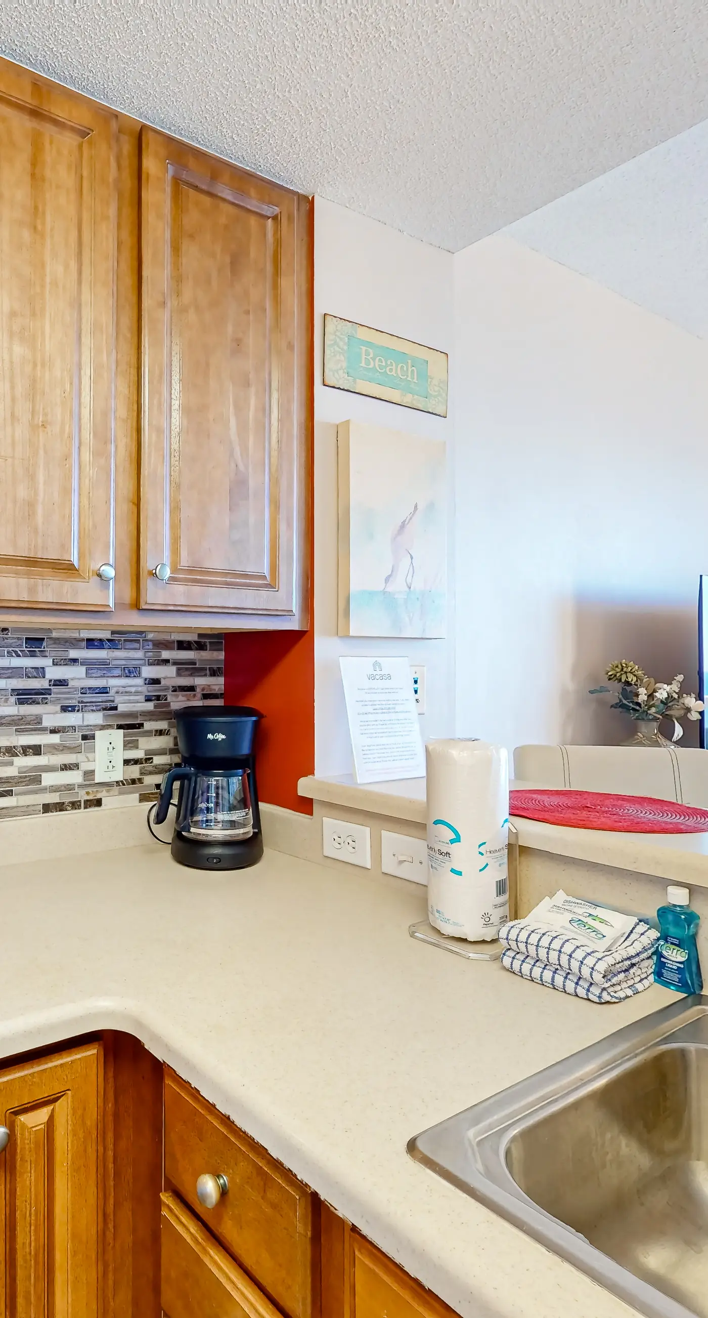 Cozy & colorful beachfront condo with balcony, pools, & fitness center