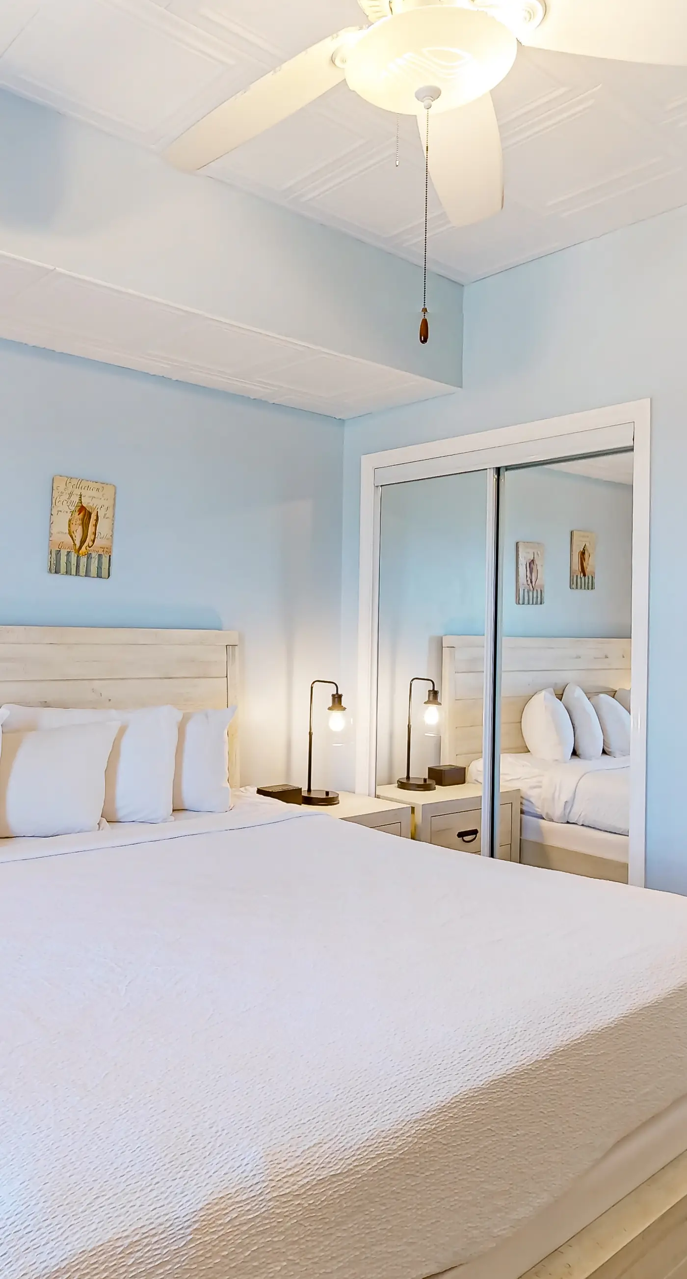 Cozy & colorful beachfront condo with balcony, pools, & fitness center