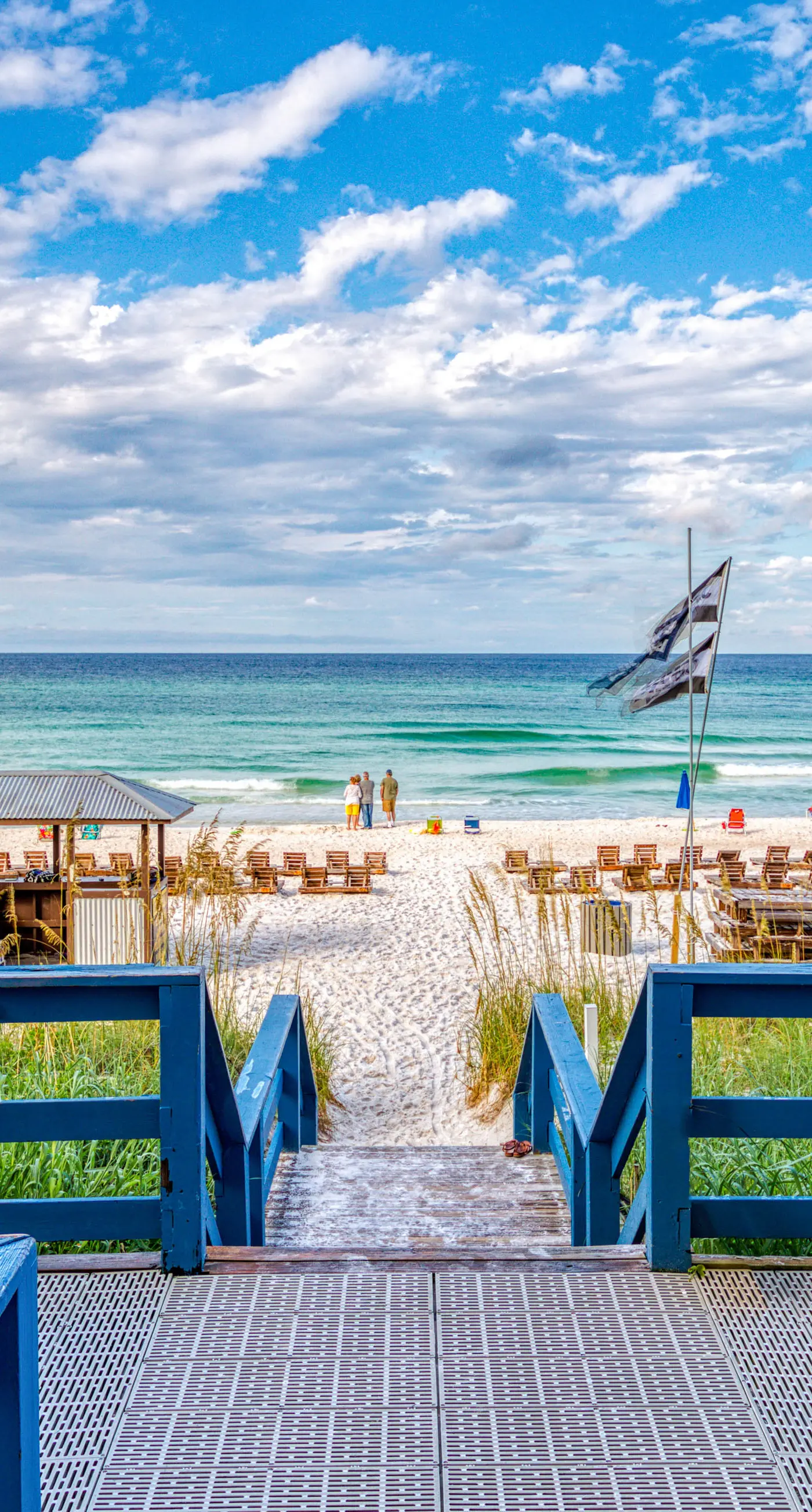 Cozy & colorful beachfront condo with balcony, pools, & fitness center