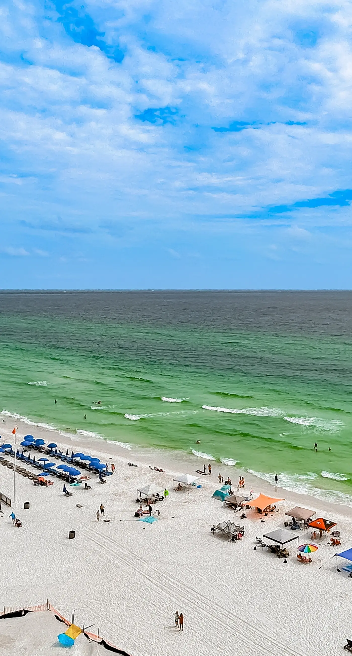 Cozy & colorful beachfront condo with balcony, pools, & fitness center