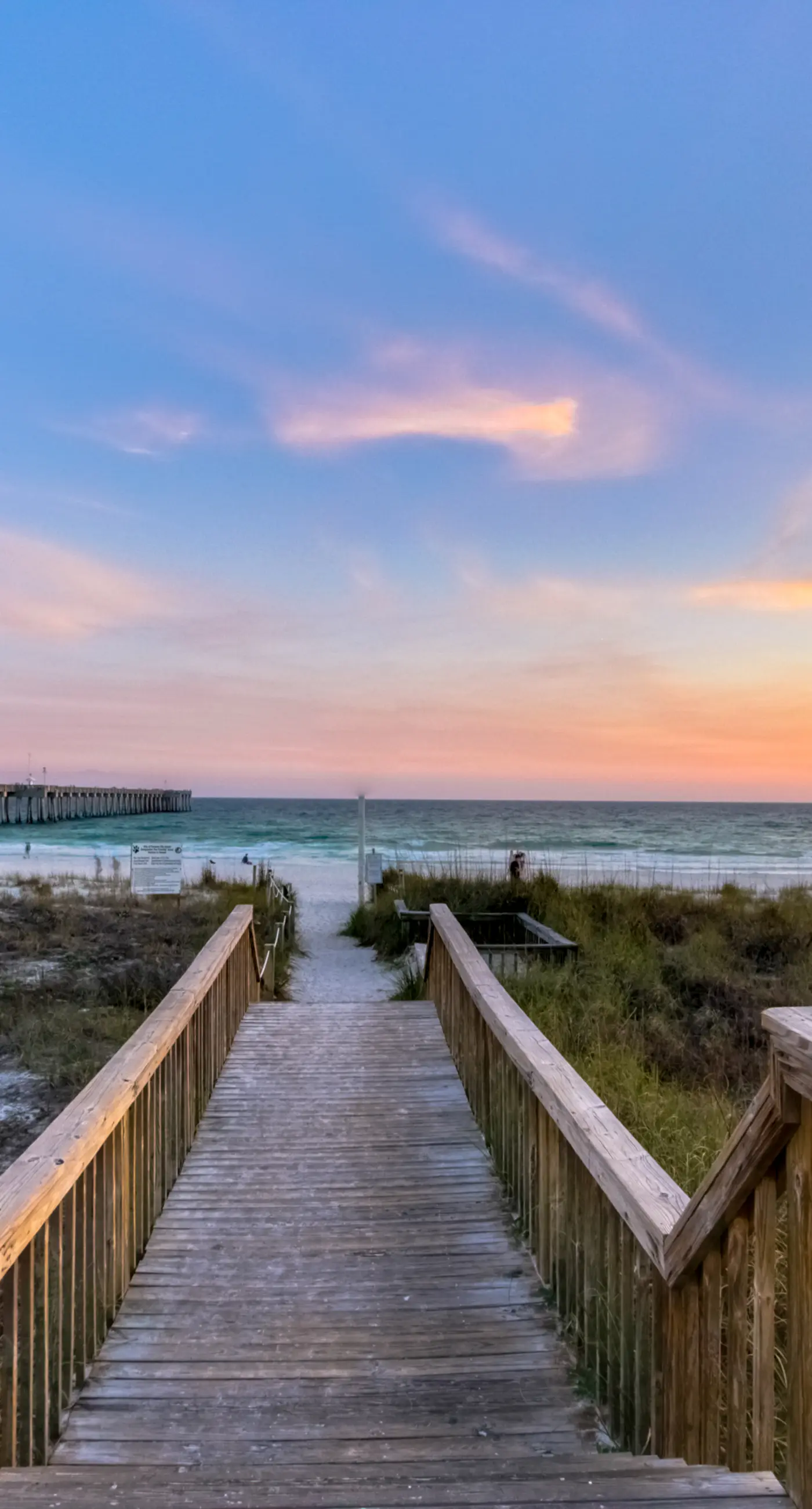 Cozy & colorful beachfront condo with balcony, pools, & fitness center