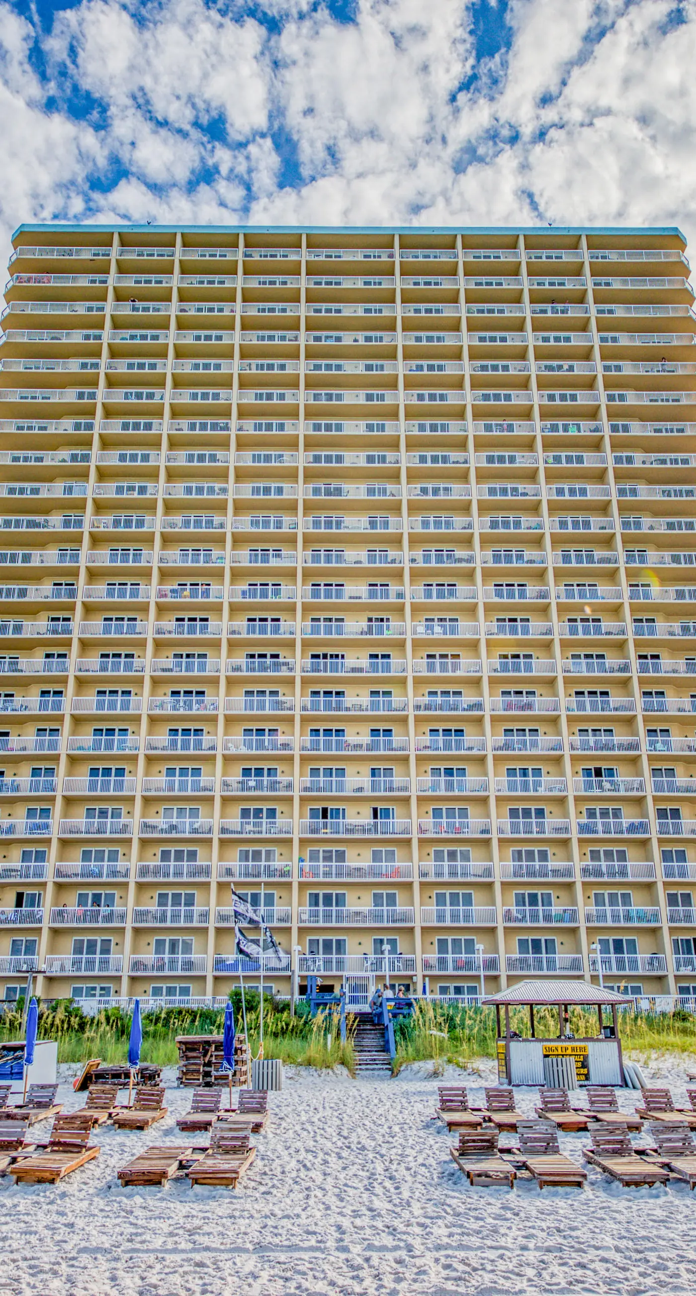 Cozy & colorful beachfront condo with balcony, pools, & fitness center