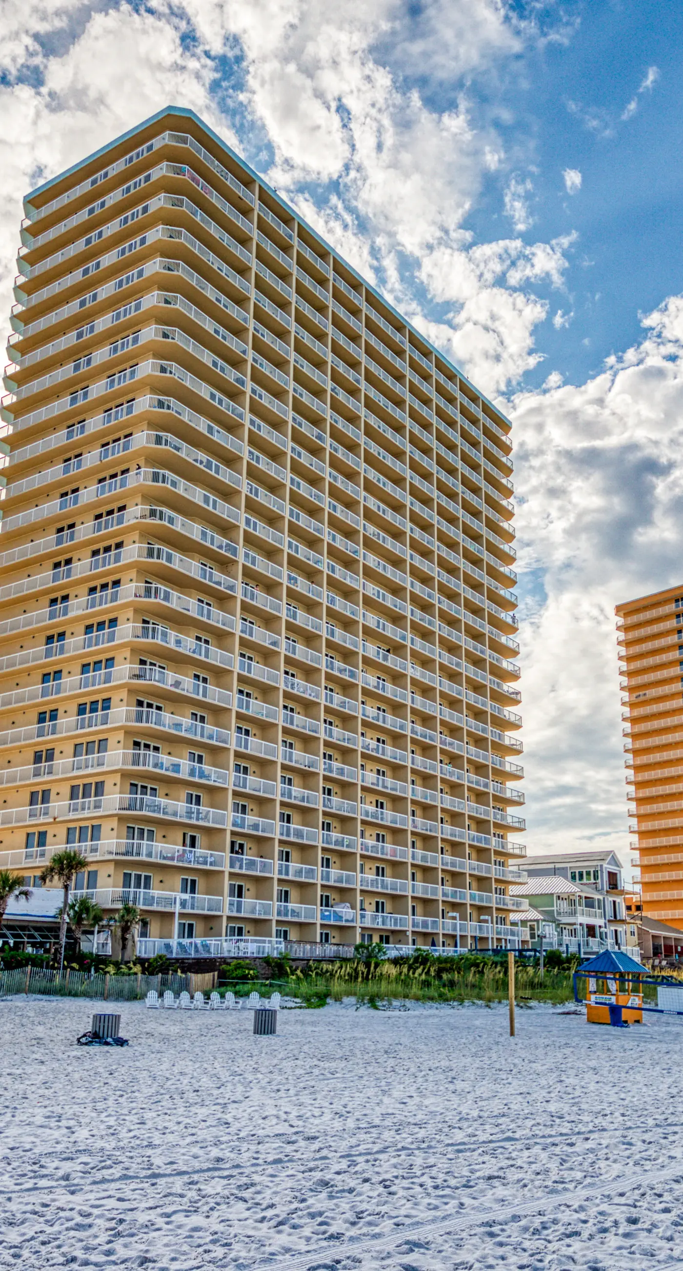 Cozy & colorful beachfront condo with balcony, pools, & fitness center