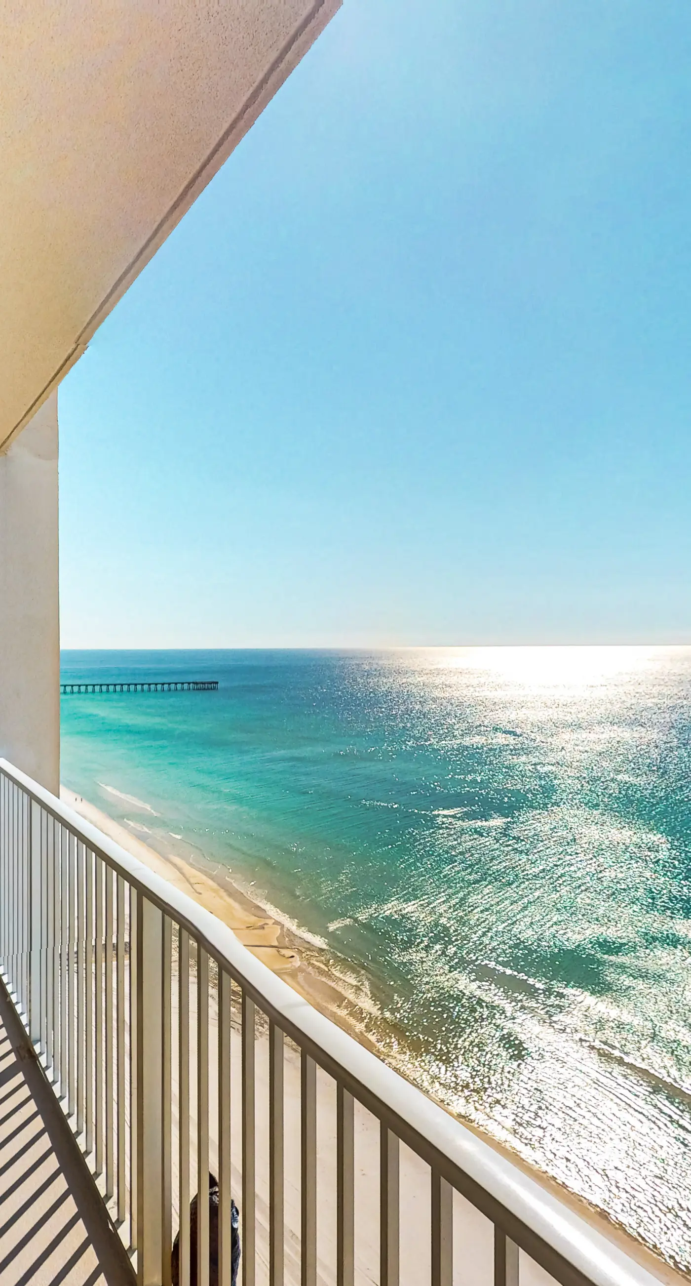 Gulf-front getaway with water views, pools, hot tub, game room & gym