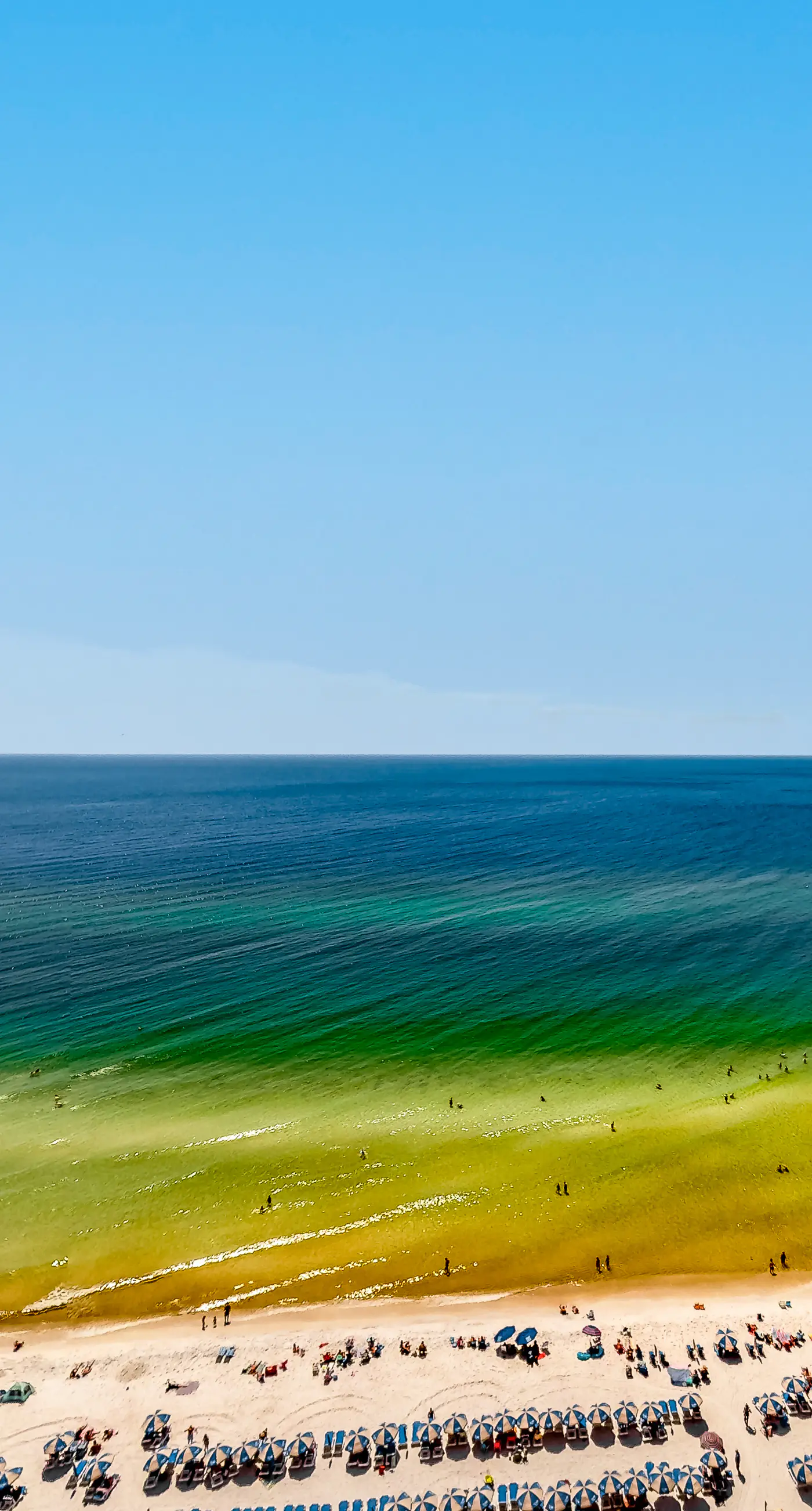 Gulf-front getaway with water views, pools, hot tub, game room & gym