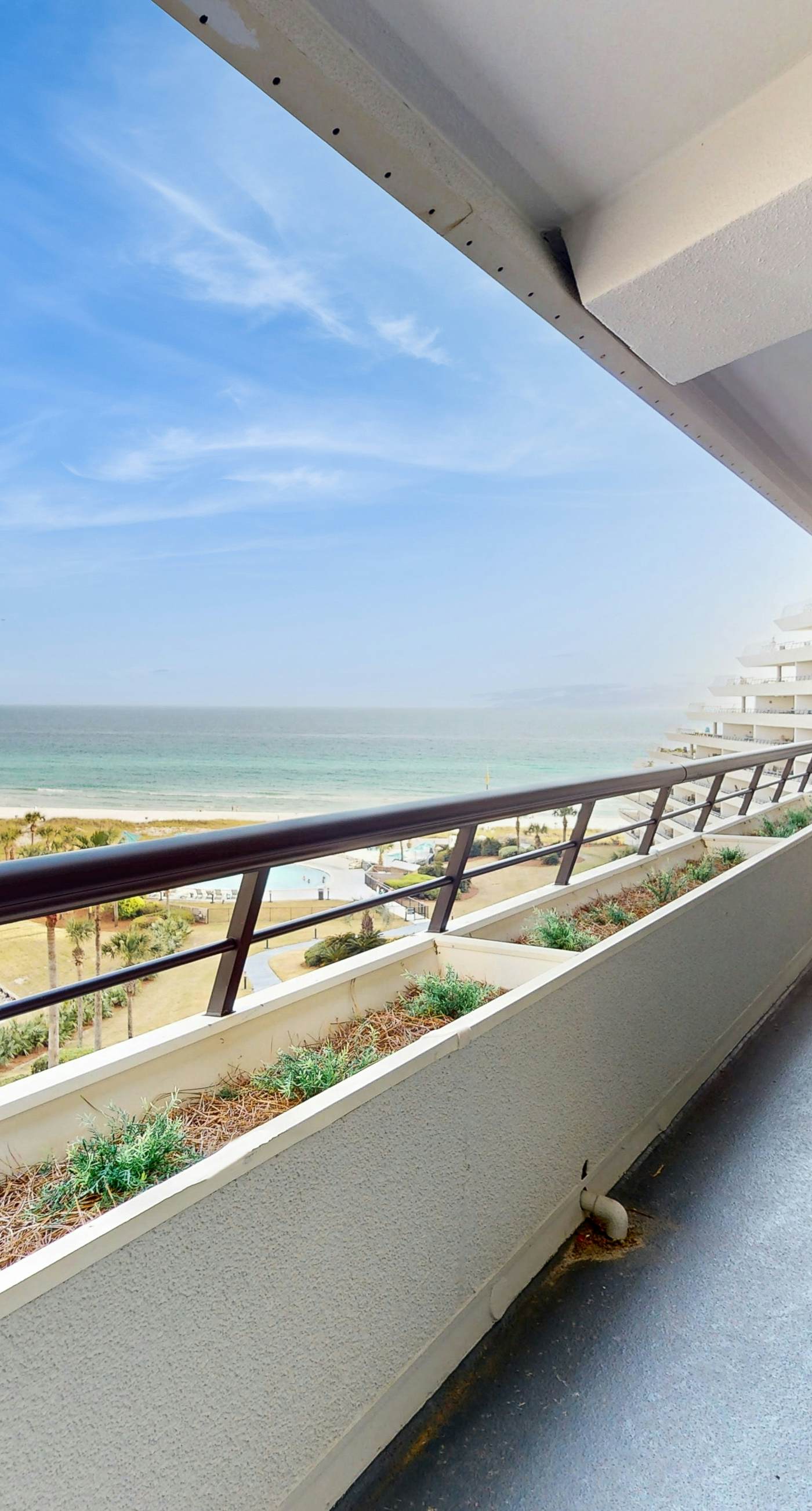 8th floor condo with Gulf views, balcony, pools, hot tubs, central AC, and WiFi