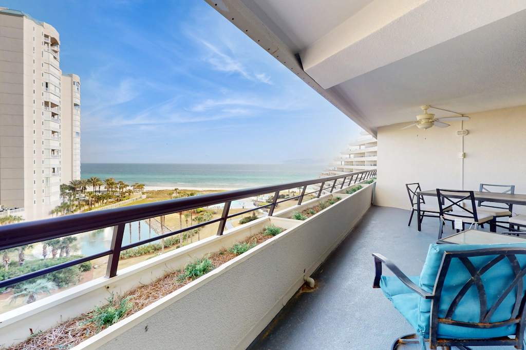8th floor condo with Gulf views, balcony, pools, hot tubs, central AC, and WiFi