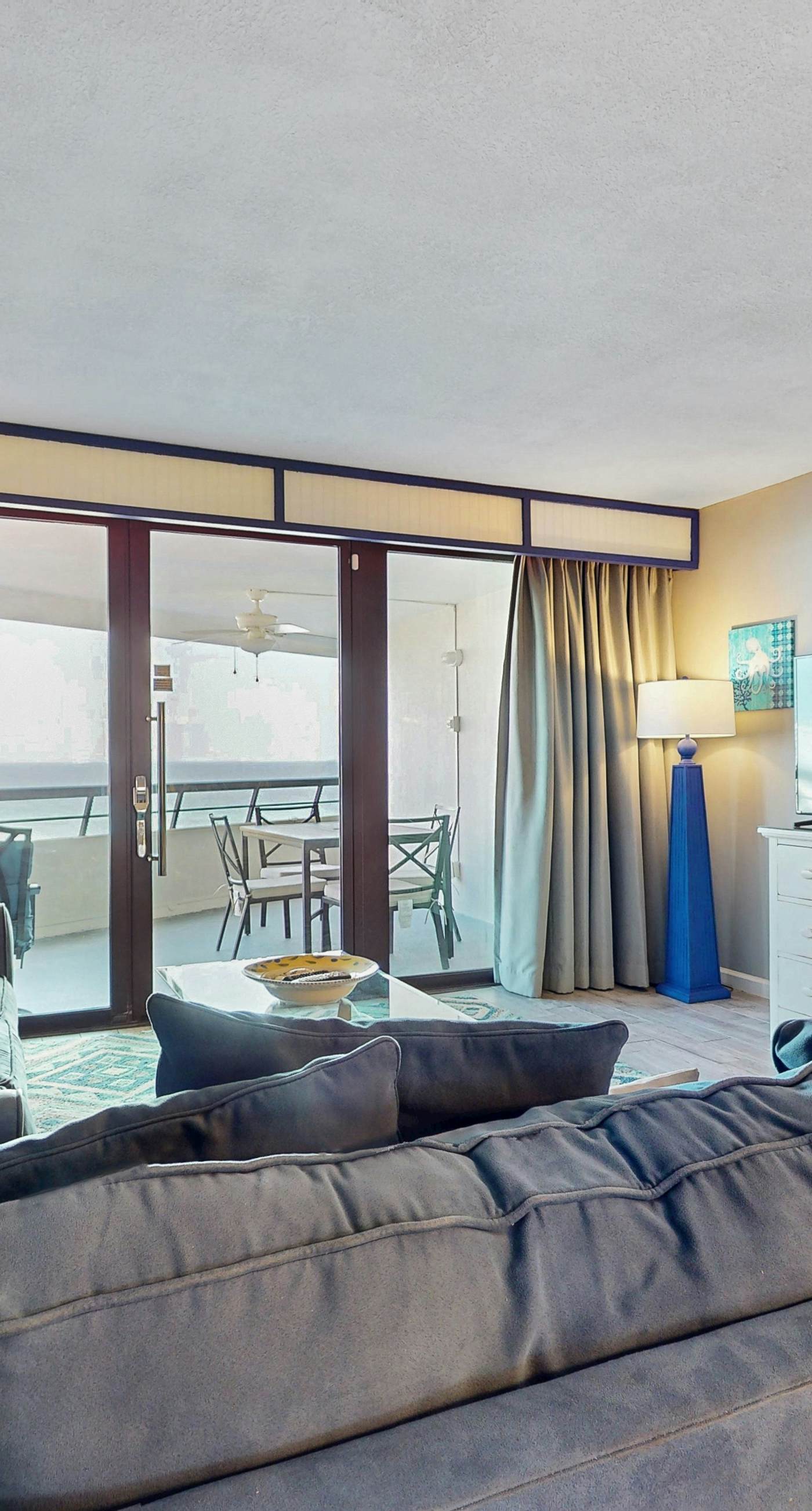 8th floor condo with Gulf views, balcony, pools, hot tubs, central AC, and WiFi