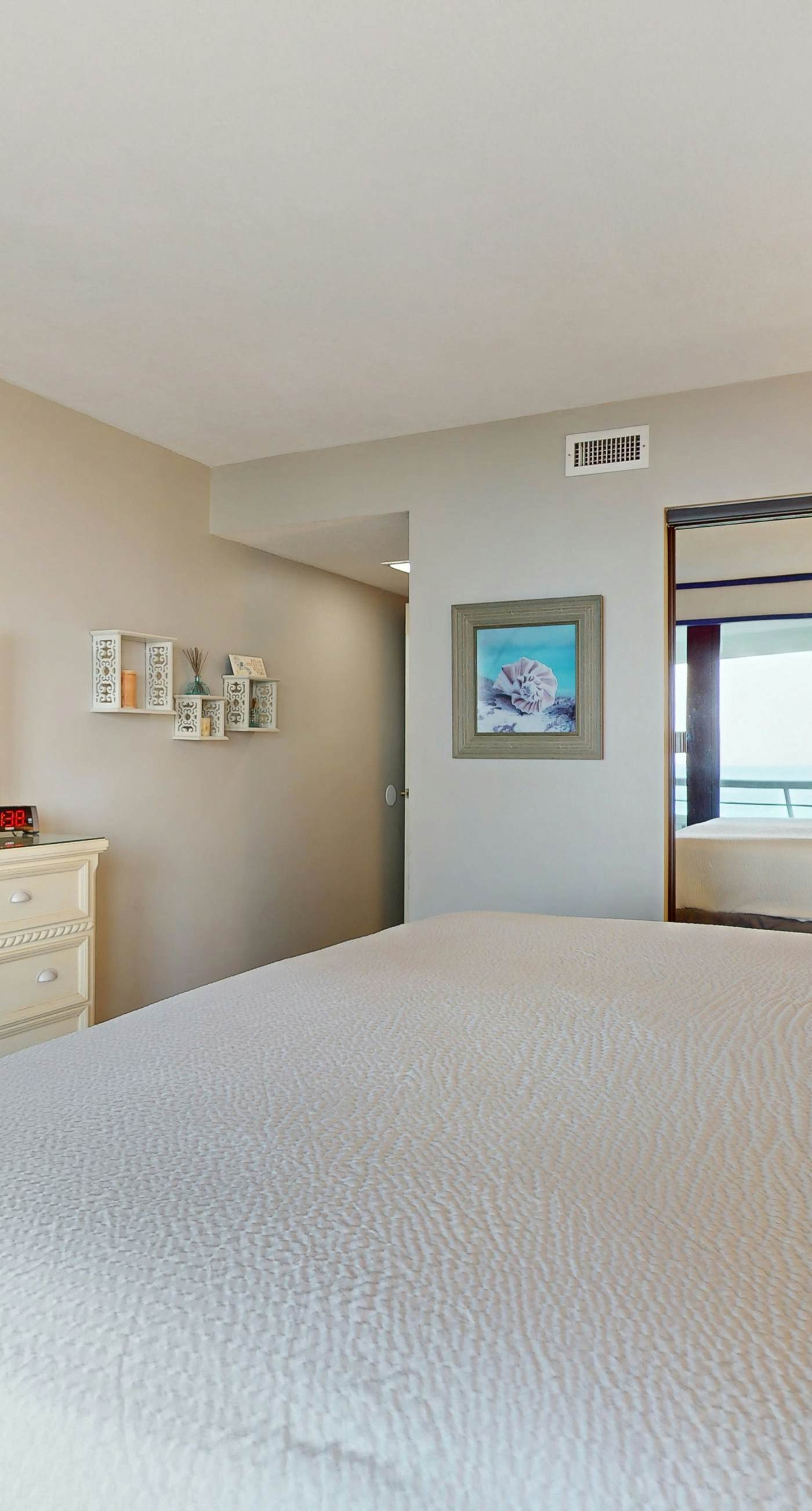 8th floor condo with Gulf views, balcony, pools, hot tubs, central AC, and WiFi