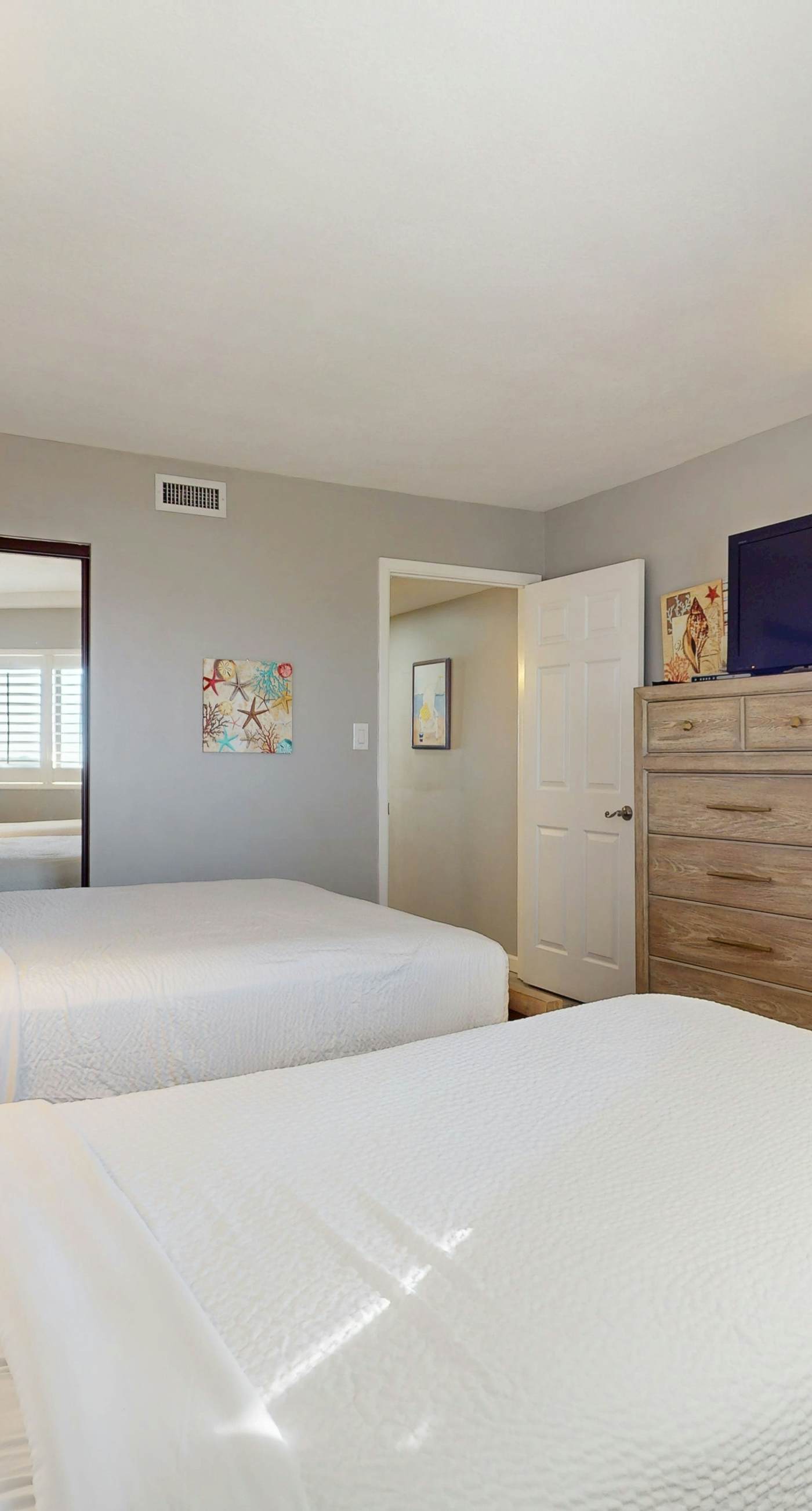 8th floor condo with Gulf views, balcony, pools, hot tubs, central AC, and WiFi