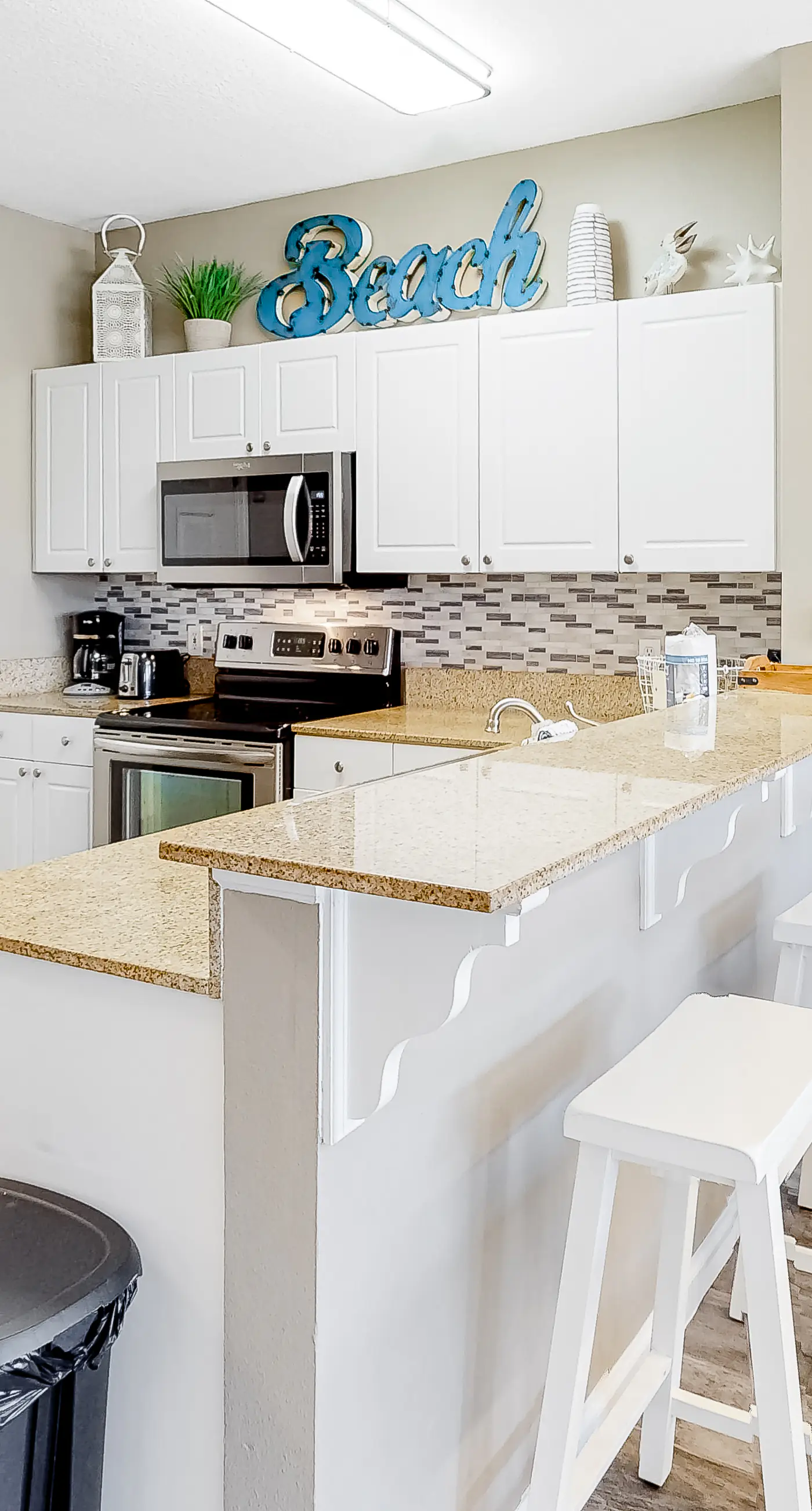 Updated ground floor beachside condo with private beach access & patio