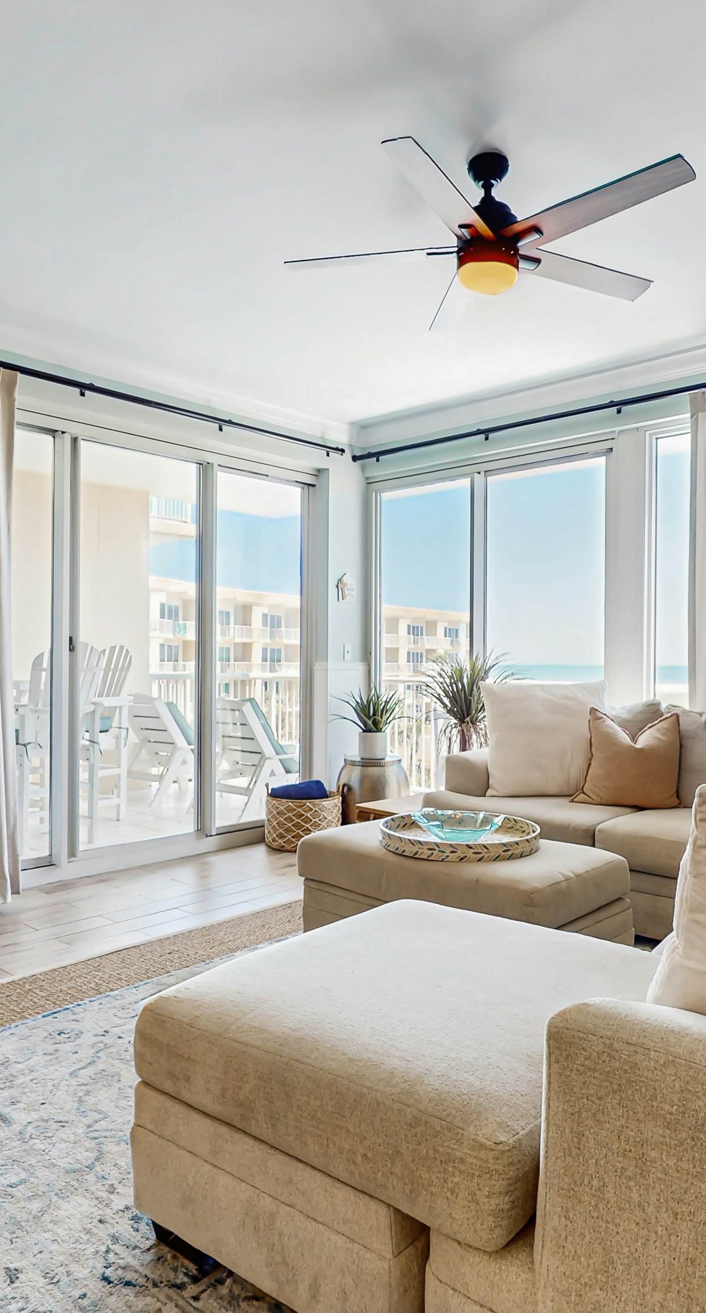 Gulf-front condo with balcony and access to pools, hot tub, gym, & private beach