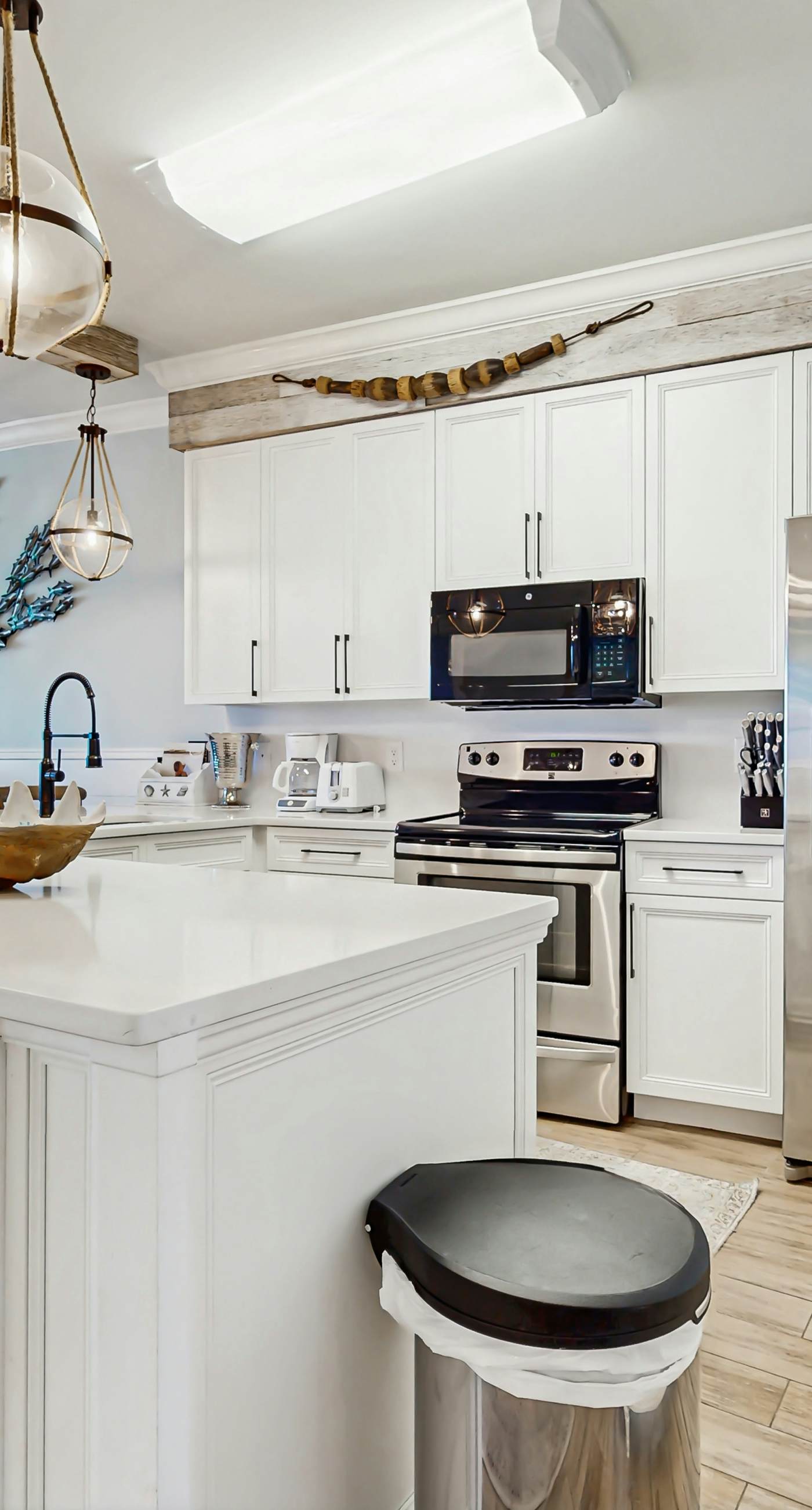 Gulf-front condo with balcony and access to pools, hot tub, gym, & private beach