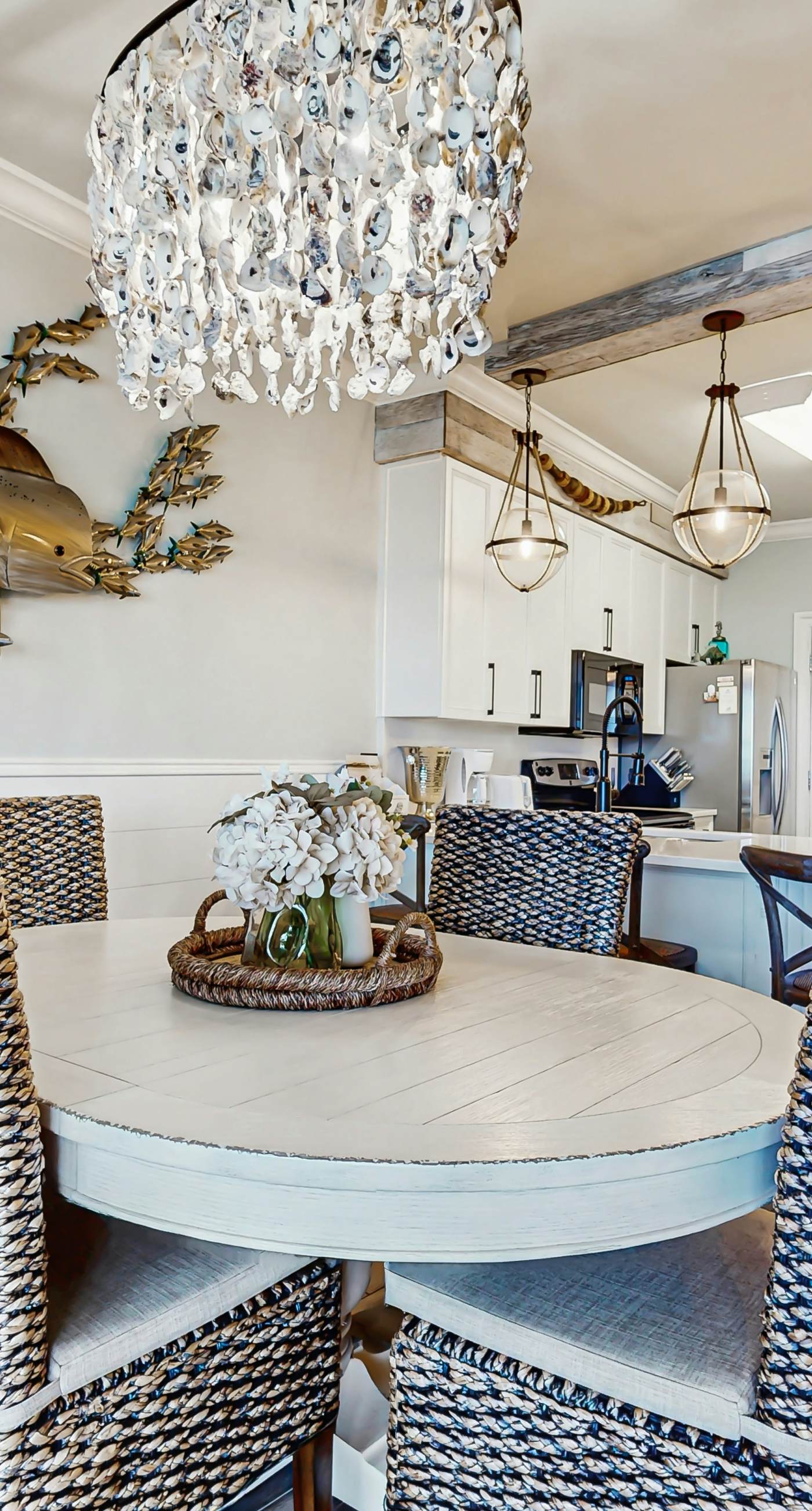 Gulf-front condo with balcony and access to pools, hot tub, gym, & private beach