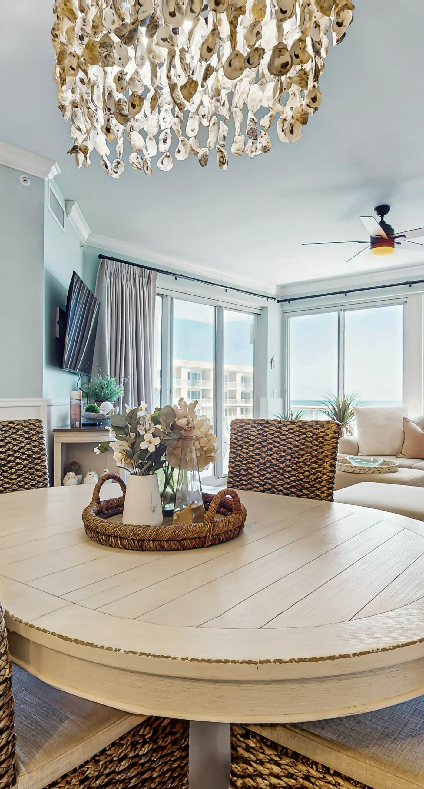 Gulf-front condo with balcony and access to pools, hot tub, gym, & private beach