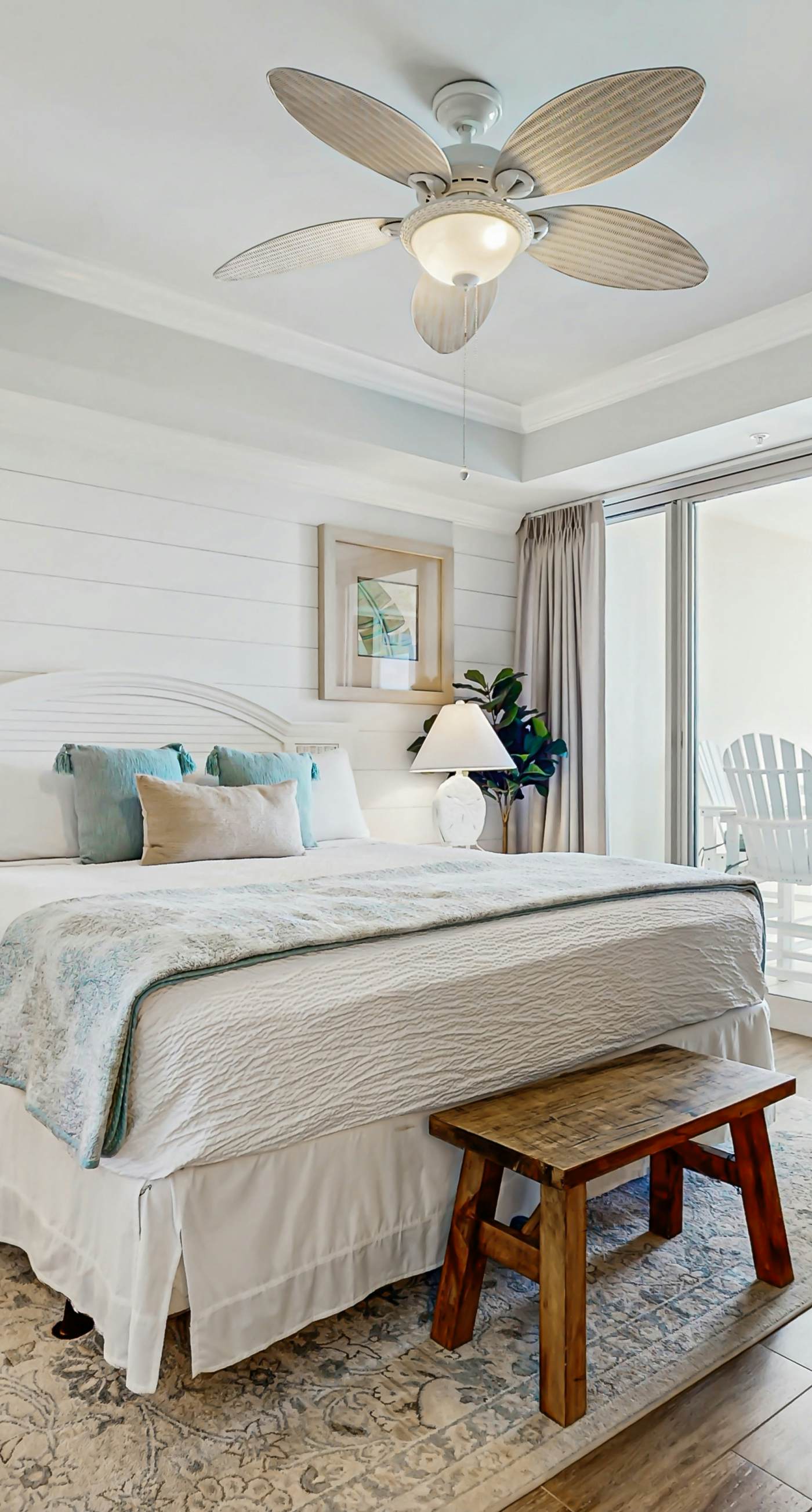 Gulf-front condo with balcony and access to pools, hot tub, gym, & private beach