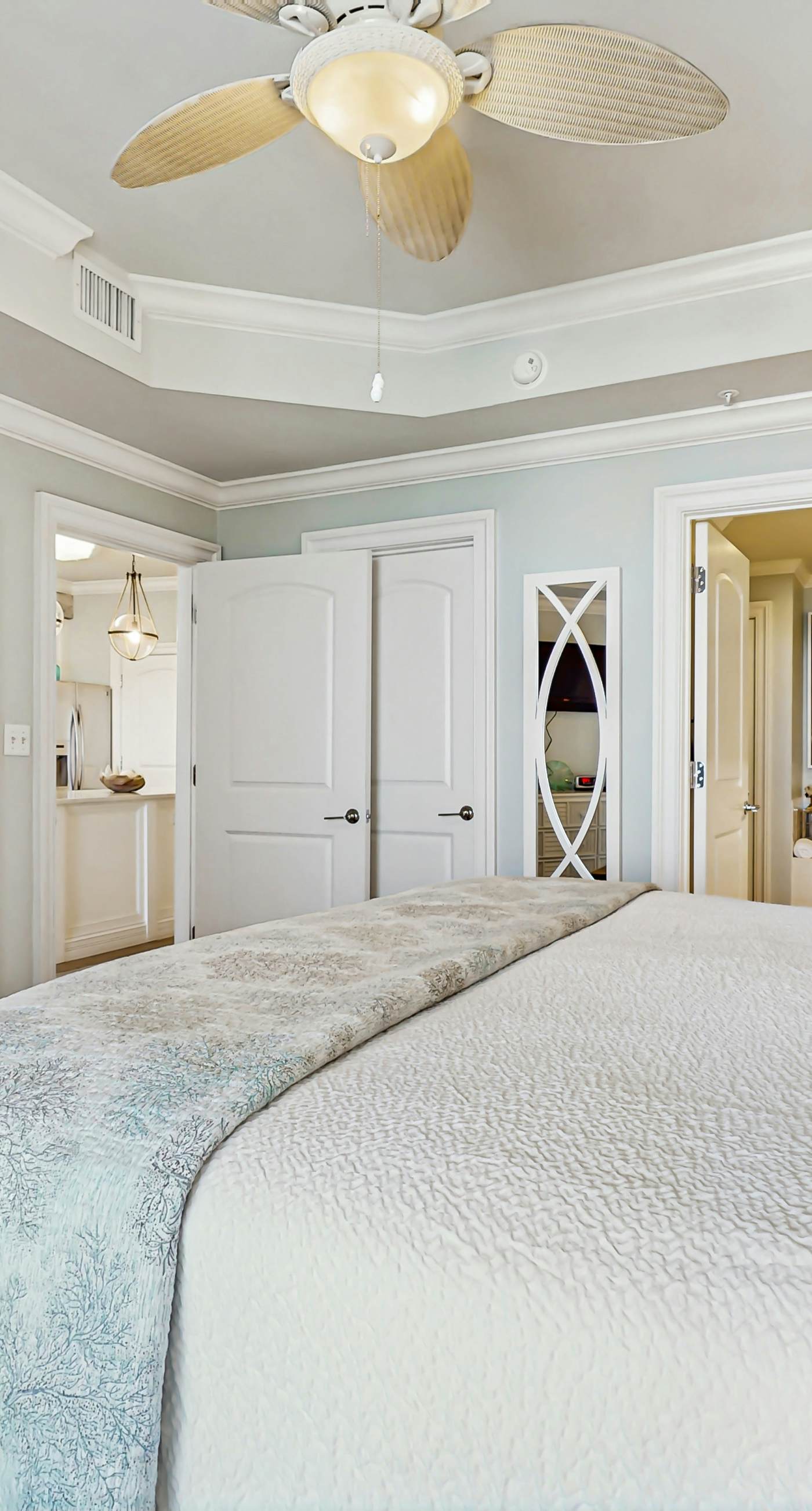 Gulf-front condo with balcony and access to pools, hot tub, gym, & private beach